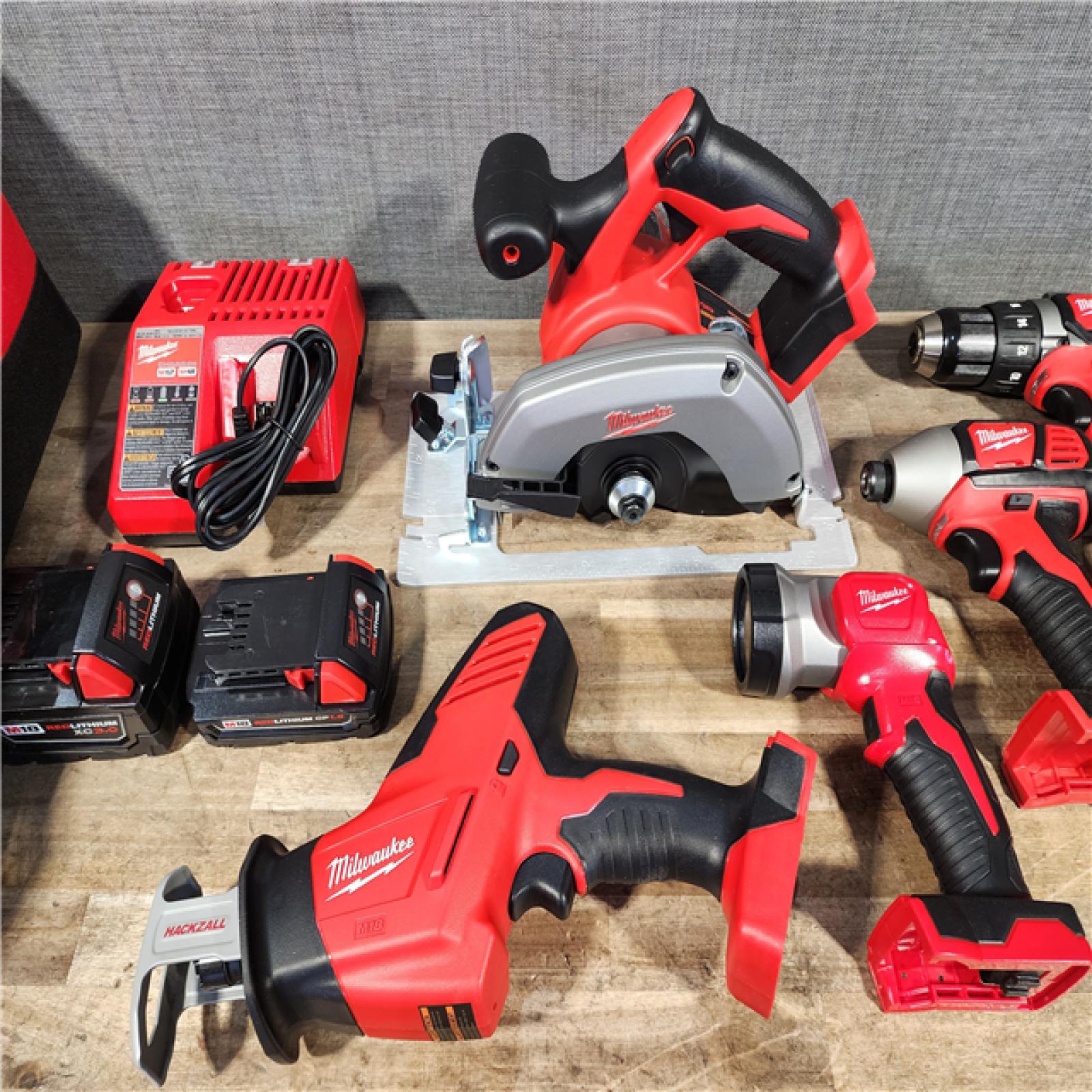 HOUSTON LOCATION - AS-IS Milwaukee M18 18-Volt Lithium-Ion Cordless Combo Tool Kit (5-Tool) with (1) 3.0Ah and (1) 1.5Ah Battery  (1) Charger  (1) Tool Bag