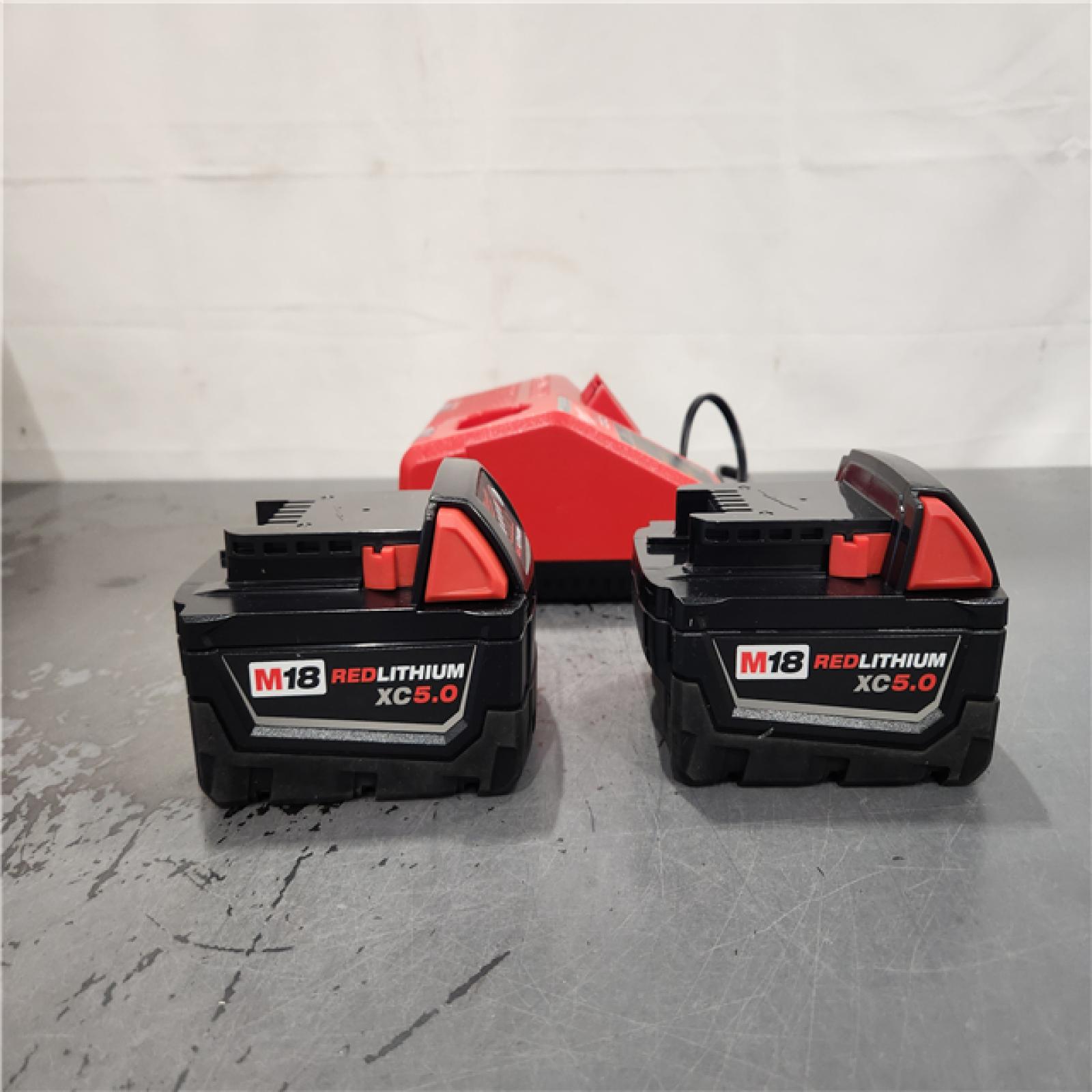 AS-IS- Milwaukee M18 18-Volt Lithium-Ion XC Starter Kit with Two 5.0Ah Batteries and Charger