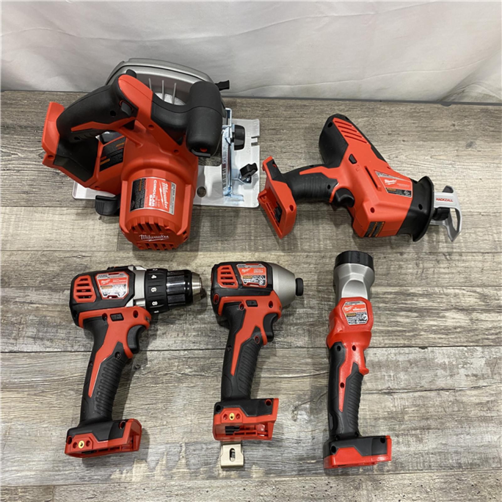AS-IS Milwaukee 18V Lithium-Ion Cordless Combo Kit (5-Tool) with (1) 3.0Ah and (1) 1.5Ah Battery  (1) Charger  (1) Tool Bag
