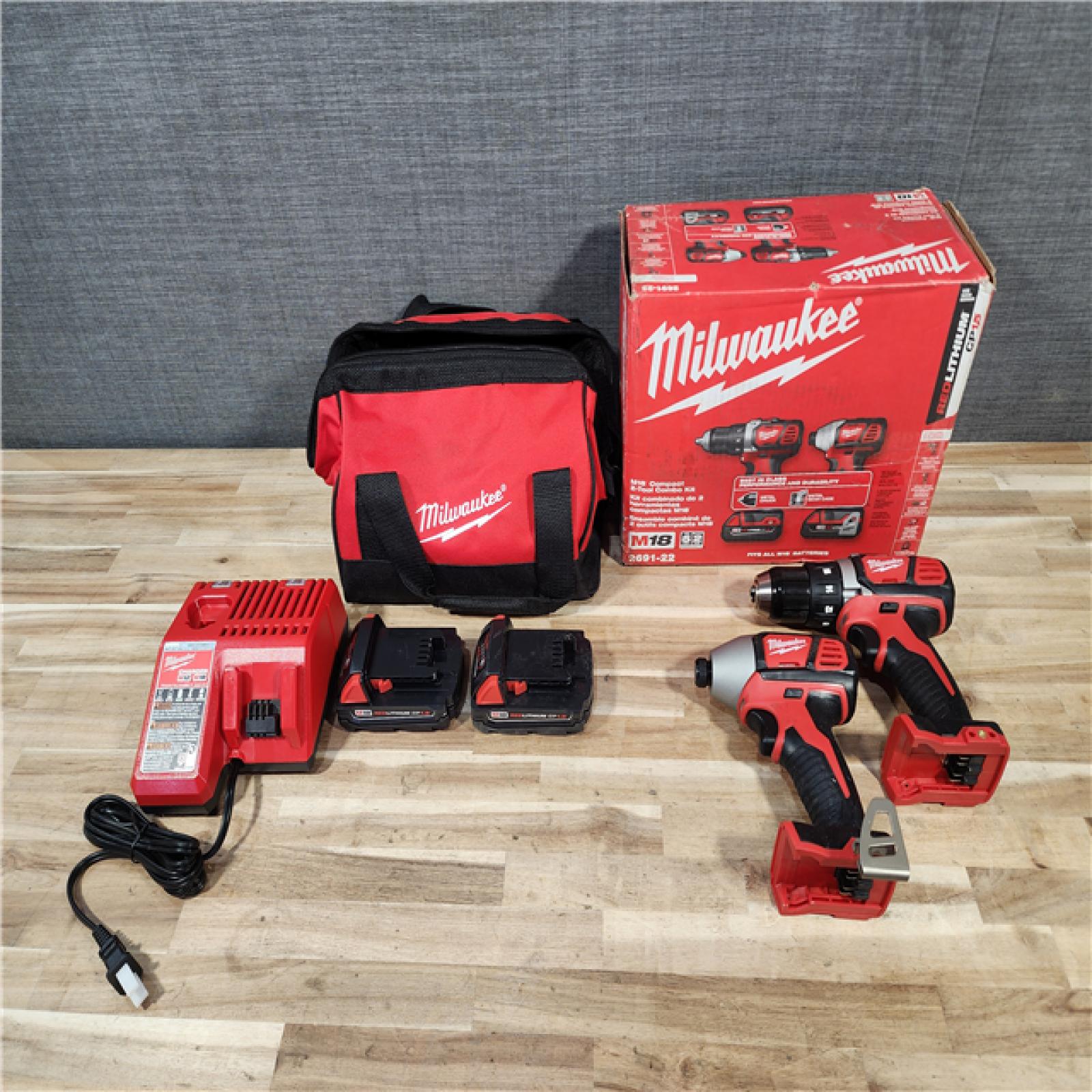 HOUSTON LOCATION - AS-IS Milwaukee  18V Lithium-Ion Cordless Drill Driver/Impact Driver Combo Kit
