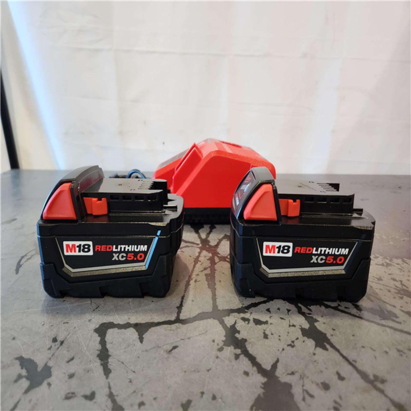 AS-IS- Milwaukee 18-Volt Lithium-Ion XC Starter Kit with Two 5.0Ah Batteries and Charger
