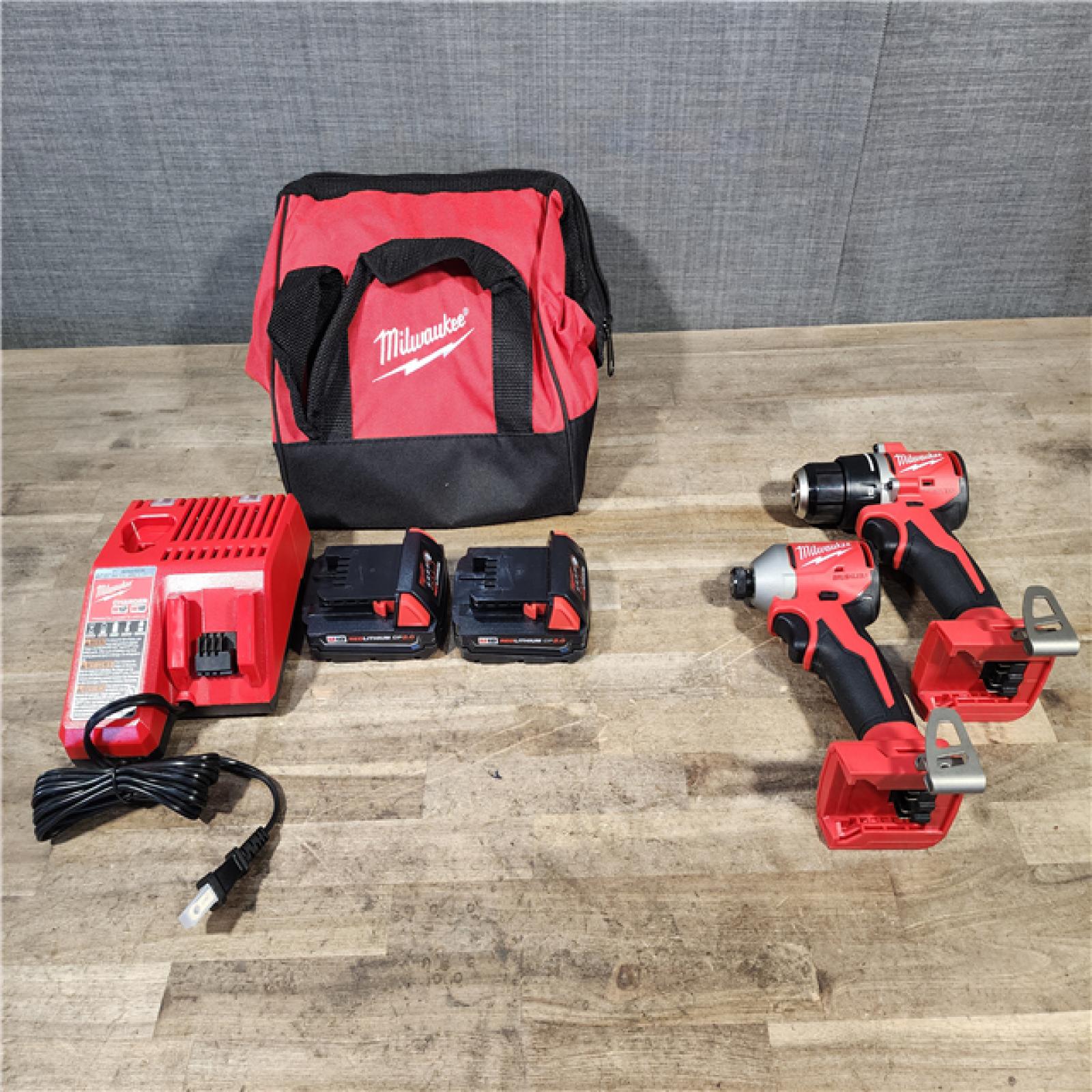 HOUSTON LOCATION - AS-IS Milwaukee M18 18V Lithium-Ion Brushless Cordless Compact Drill/Impact Combo Kit (2-Tool) W/(2) 2.0 Ah Batteries  Charger & Bag