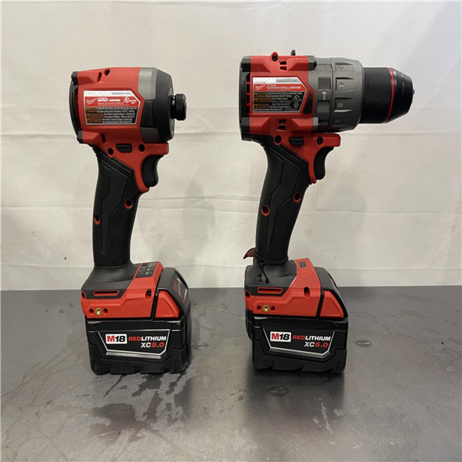 AS-IS - Milwaukee M18 FUEL 18V Lithium-Ion Brushless Cordless Hammer Drill and Impact Driver Combo Kit (2-Tool) with 2 Batteries