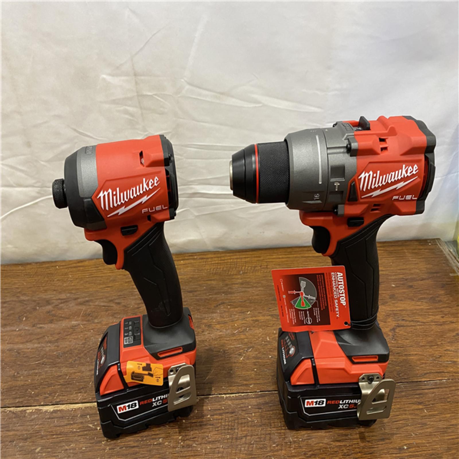 AS-IS MILWAUKEE M18 FUEL 18V Lithium-Ion Brushless Cordless Hammer Drill and Impact Driver Combo Kit (2-Tool) with 2 Batteries