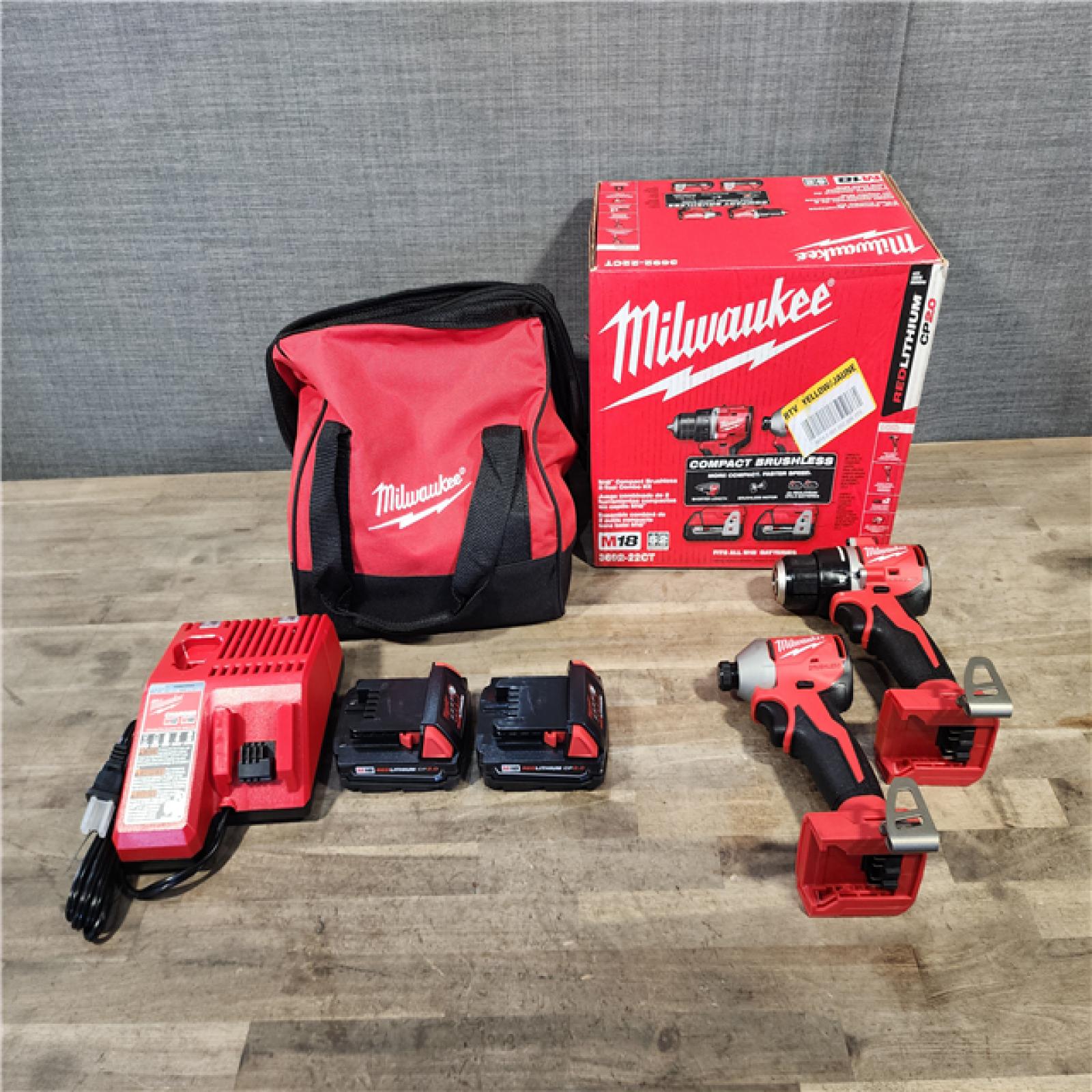 HOUSTON LOCATION - AS-IS Milwaukee M18 18V Lithium-Ion Brushless Cordless Compact Drill/Impact Combo Kit (2-Tool) W/(2) 2.0 Ah Batteries  Charger & Bag