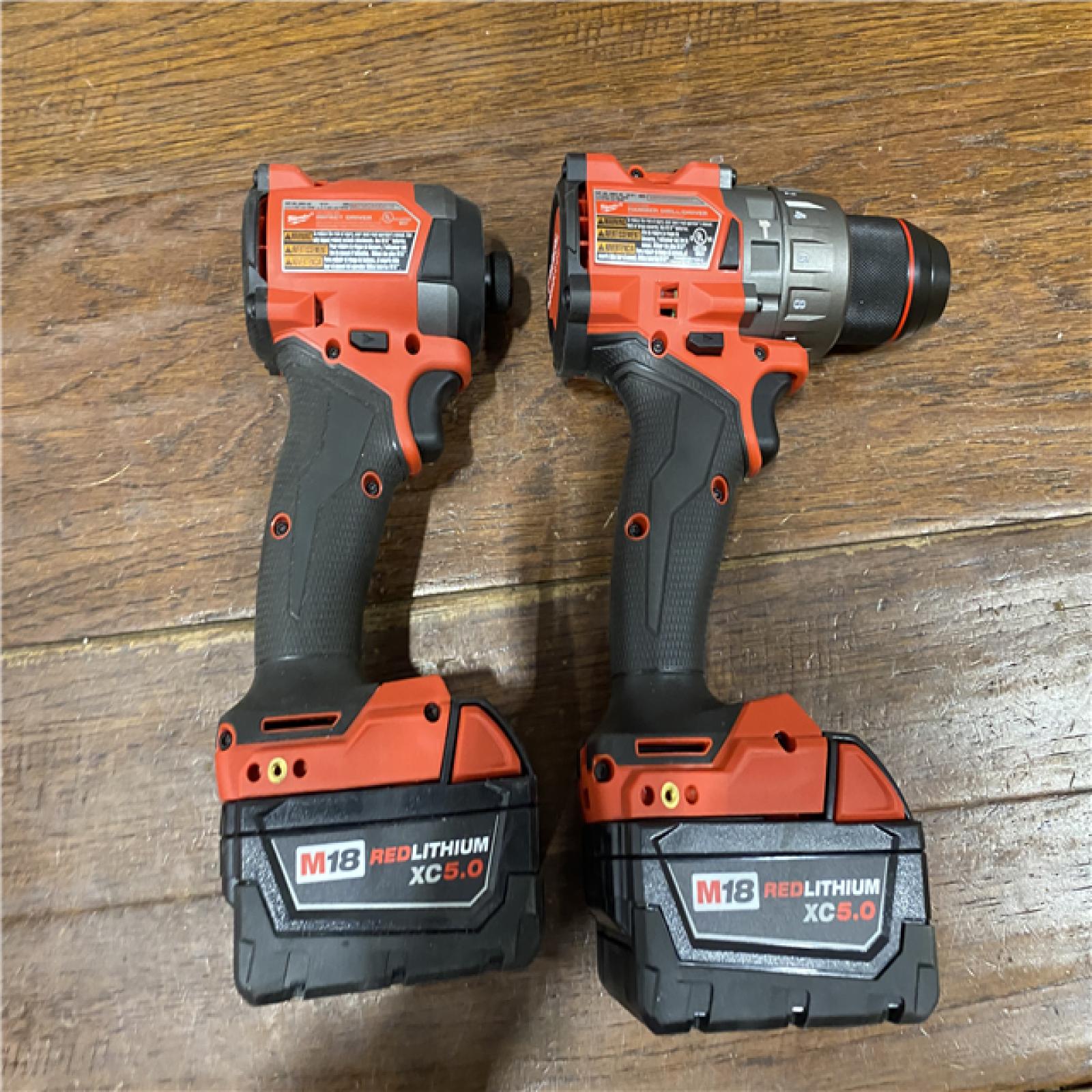 AS-IS MILWAUKEE M18 FUEL 18V Lithium-Ion Brushless Cordless Hammer Drill and Impact Driver Combo Kit (2-Tool) with 2 Batteries