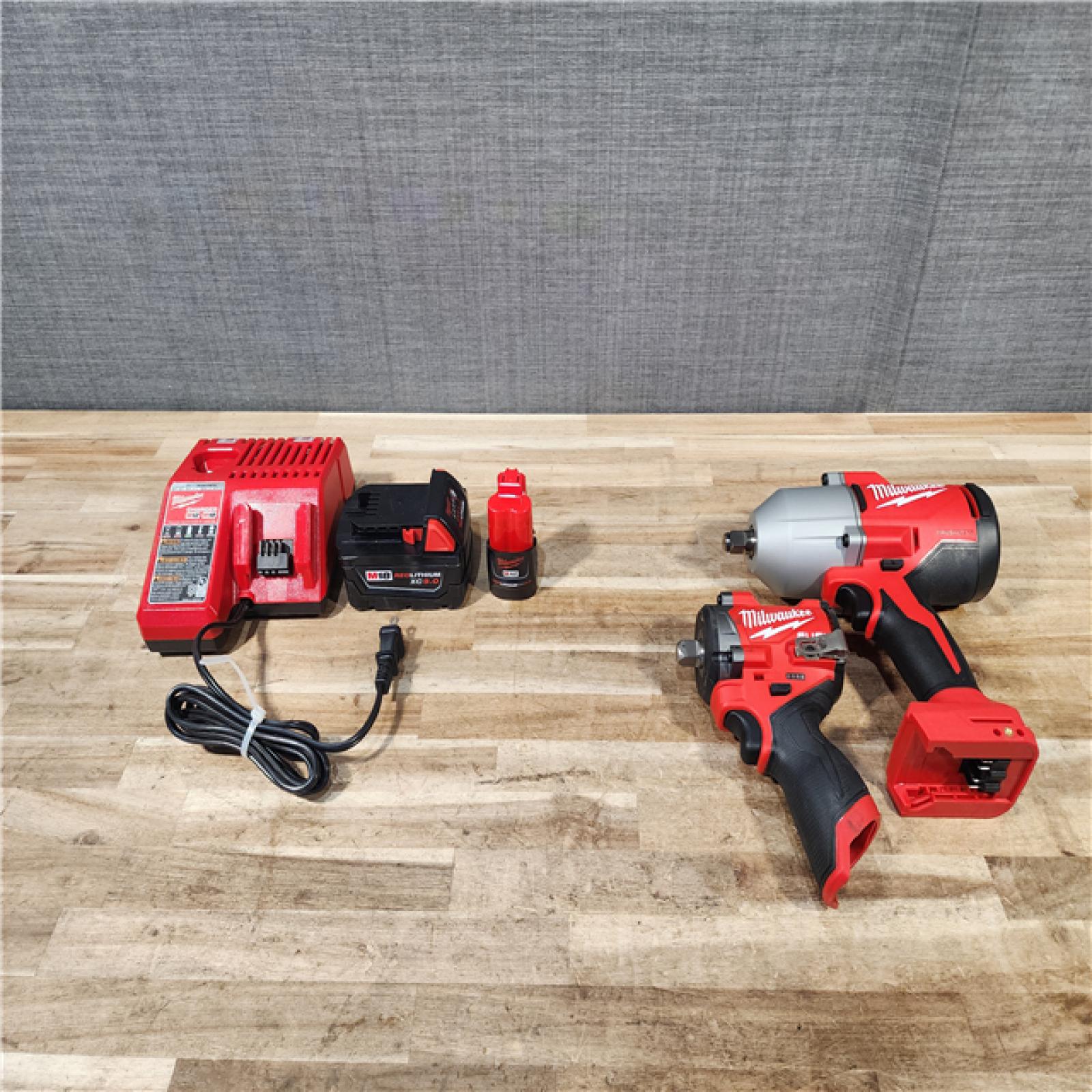 HOUSTON LOCATION - AS-IS MILWAUKEE 2 TOOL COMBO KIT W/ (2) BATTERY & CHARGER