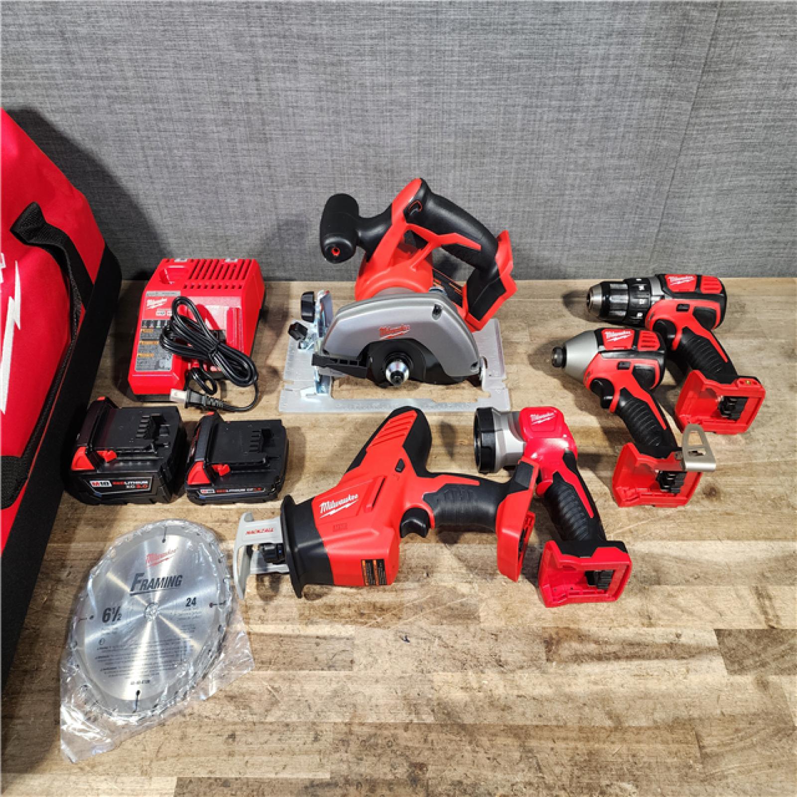 HOUSTON LOCATION - AS-IS Milwaukee M18 18-Volt Lithium-Ion Cordless Combo Tool Kit (5-Tool) with (1) 3.0Ah and (1) 1.5Ah Battery  (1) Charger  (1) Tool Bag