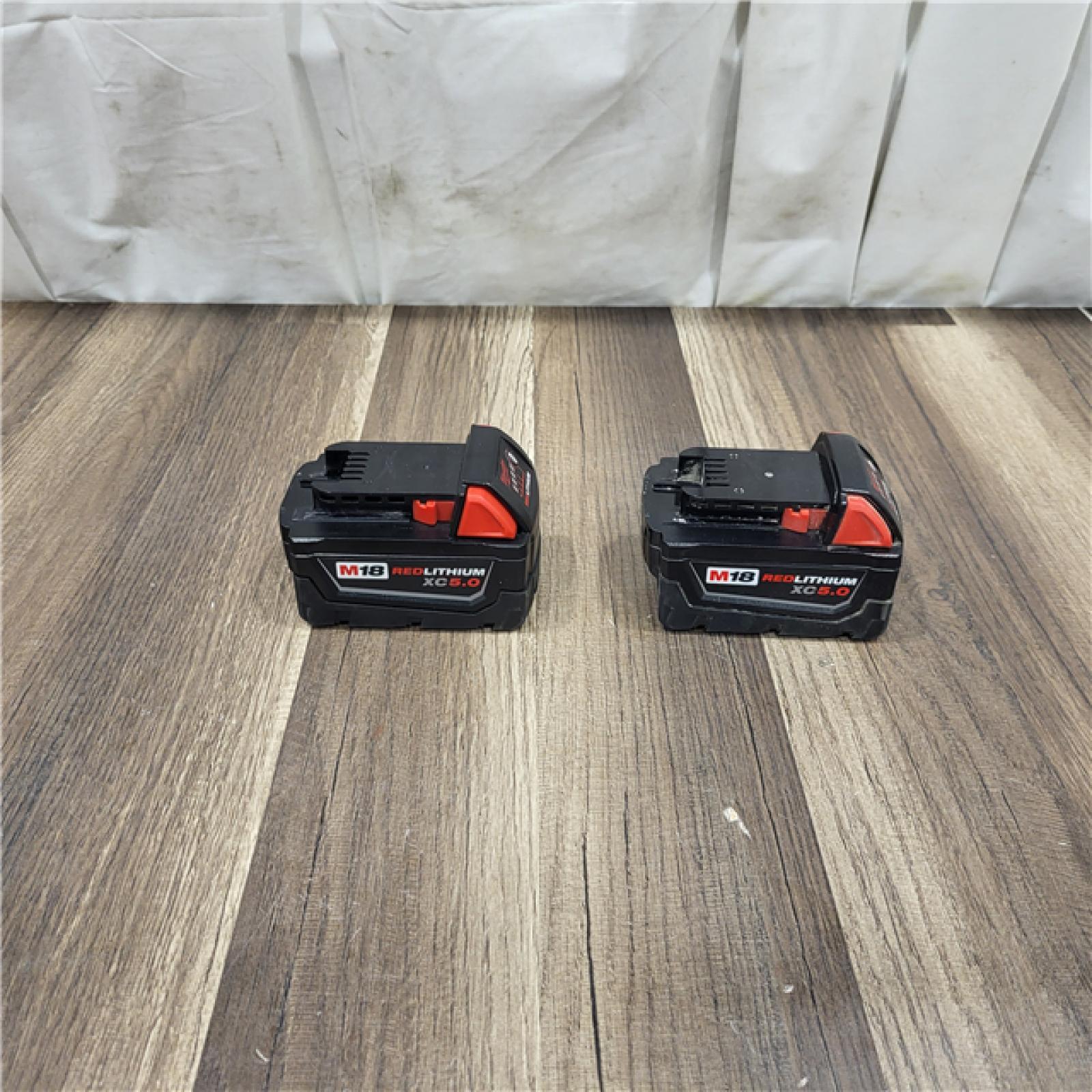AS IS Milwaukee M18 18-Volt Lithium-Ion XC Starter Kit with Two 5.0Ah Batteries / Charger (48-59-1852B)
