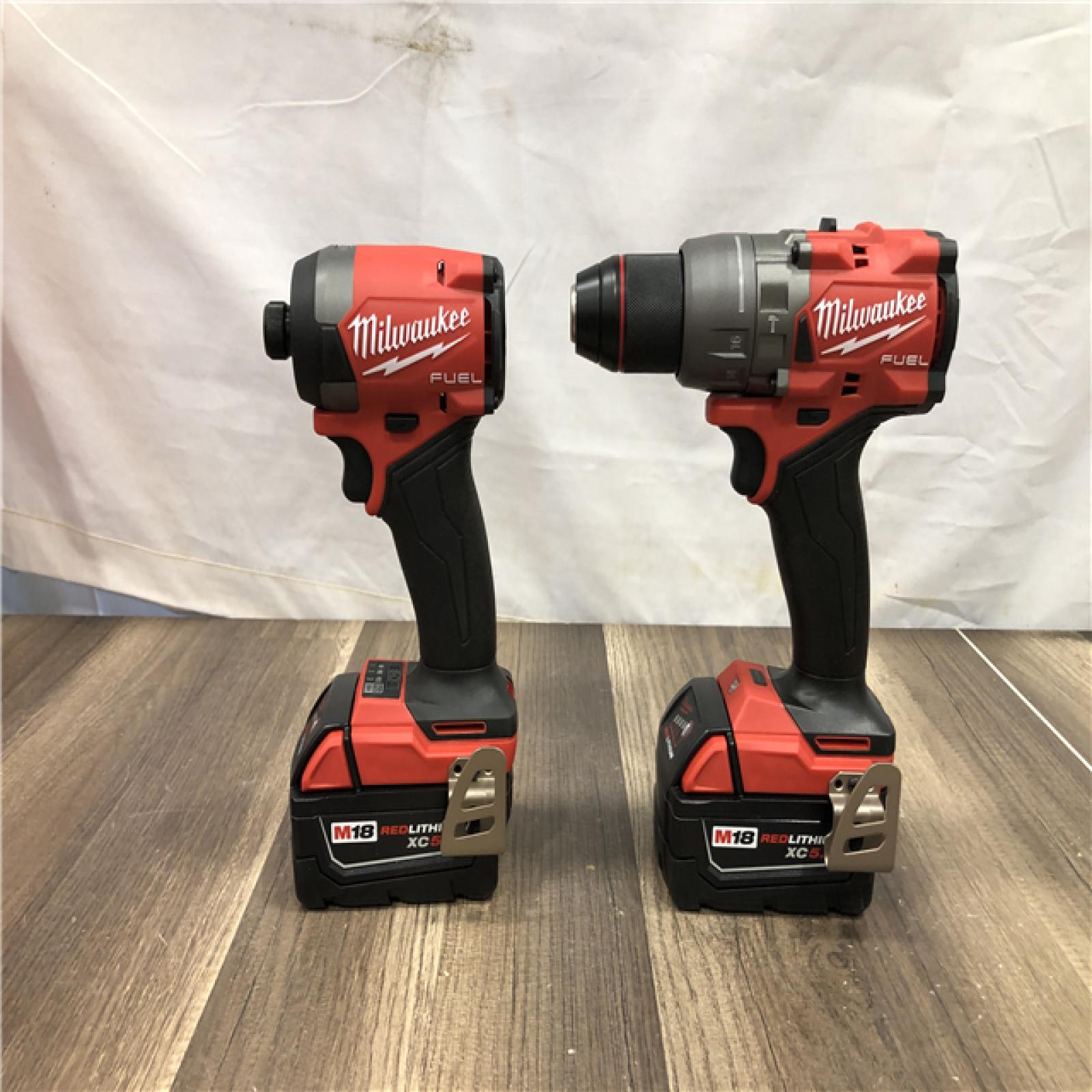 AS-IS Milwaukee FUEL 18V Lithium-Ion Brushless Cordless Hammer Drill and Impact Driver Combo Kit