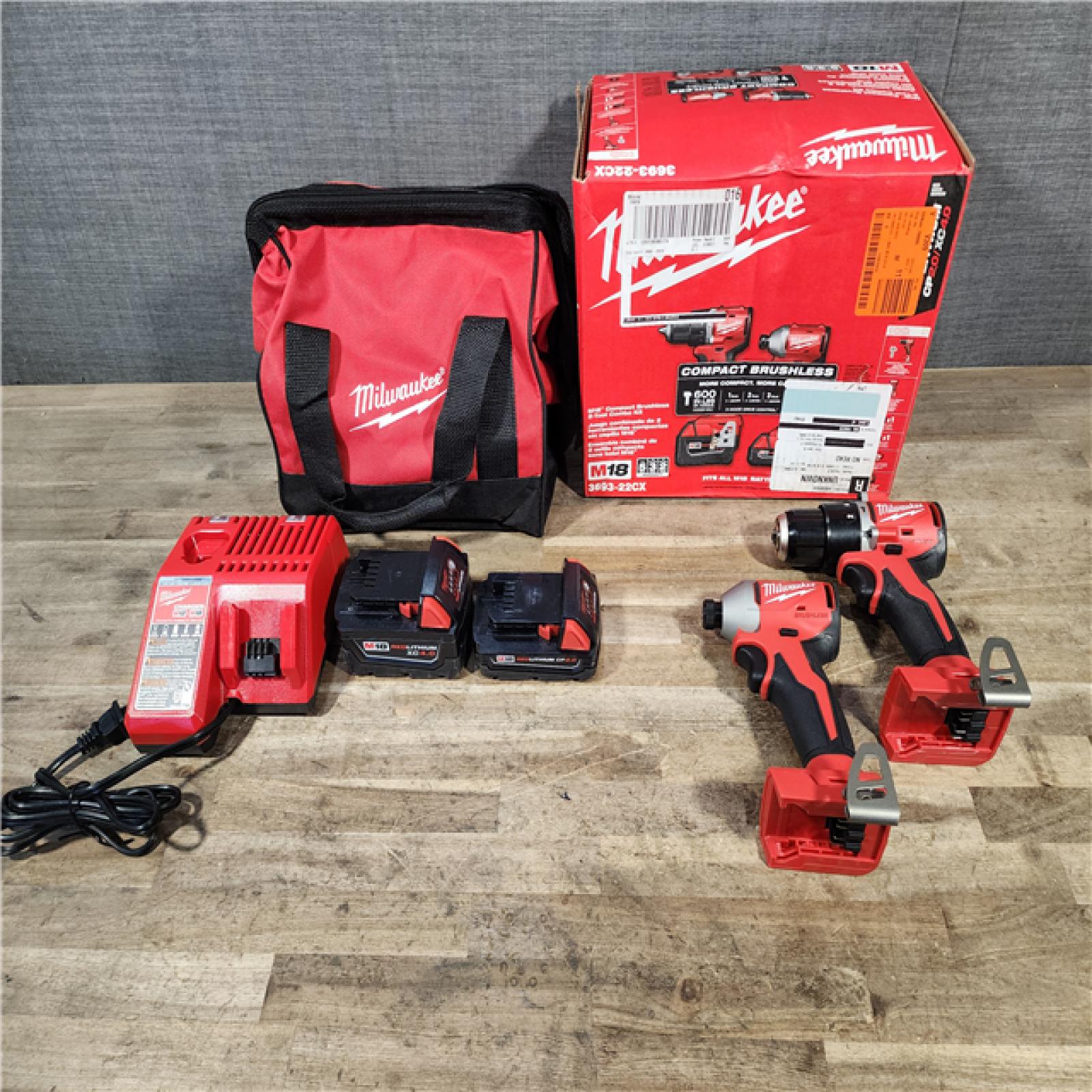 HOUSTON LOCATION - AS-IS M18 18-Volt Lithium-Ion Brushless Cordless Compact Hammer Drill/Impact Combo Kit (2-Tool) with (2) Batteries  Bag