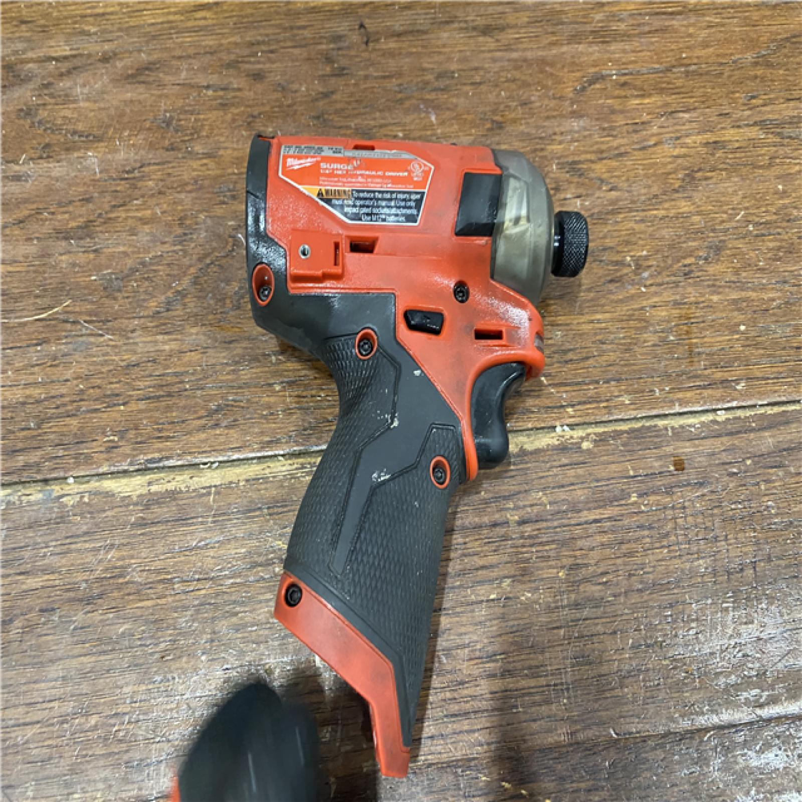 AS-IS M12 FUEL SURGE 12V Lithium-Ion Brushless Cordless 1/4 in. Hex Impact Driver Compact Kit W/Two 2.0Ah Batteries, Bag