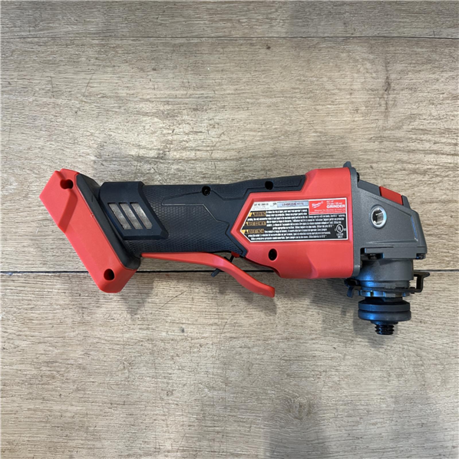 AS-IS Milwaukee FUEL 18V Lithium-Ion Brushless Cordless 4-1/2 in./5 in. Grinder w/Paddle Switch (Tool-Only)