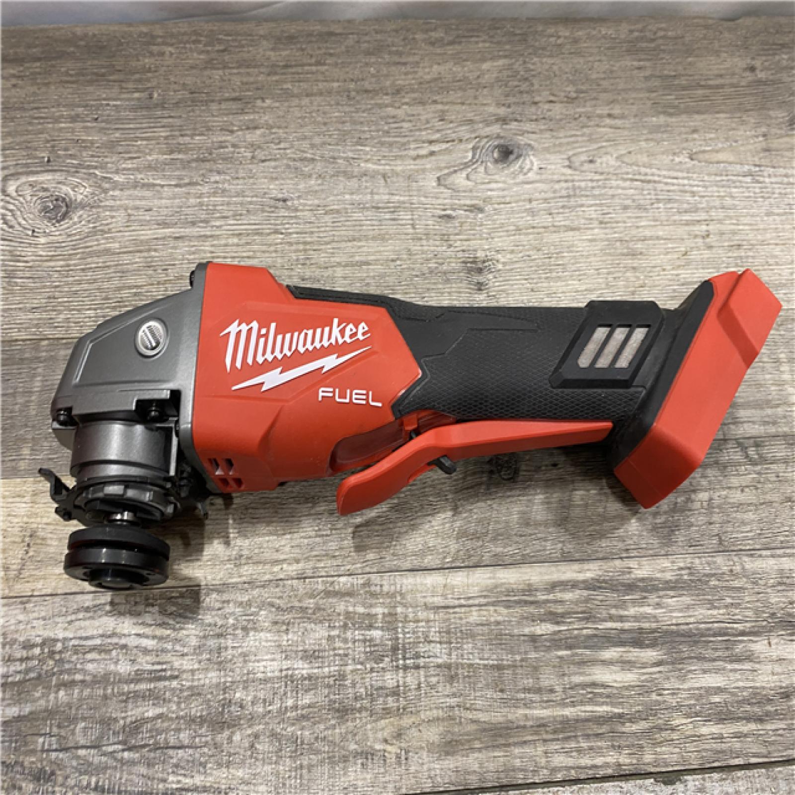 AS-IS Milwaukee FUEL 18V Lithium-Ion Brushless Cordless 4-1/2 in./5 in. Grinder with Variable Speed & Paddle Switch (Tool-Only)