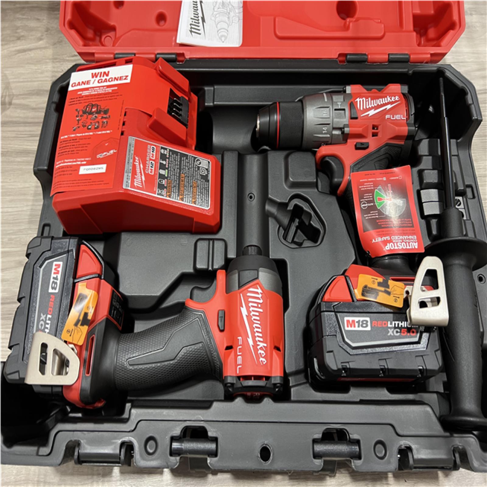 AS-IS Milwaukee FUEL 18V Lithium-Ion Brushless Cordless Hammer Drill and Impact Driver Combo Kit