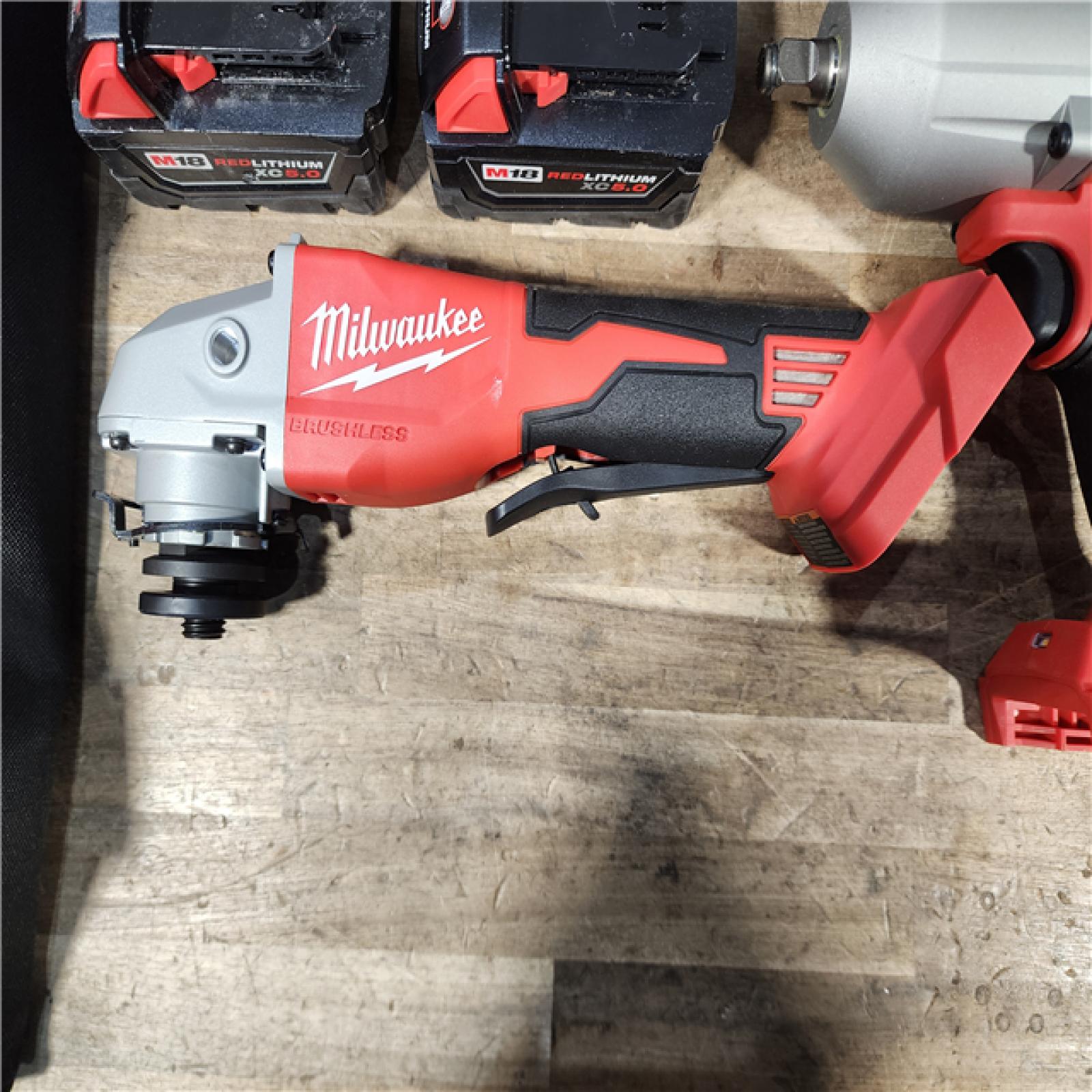 HOUSTON LOCATION - AS-IS Milwaukee M18 18-Volt Lithium-Ion Cordless Combo Kit (7-Tool) with (2) Batteries  Charger  and Tool Bag