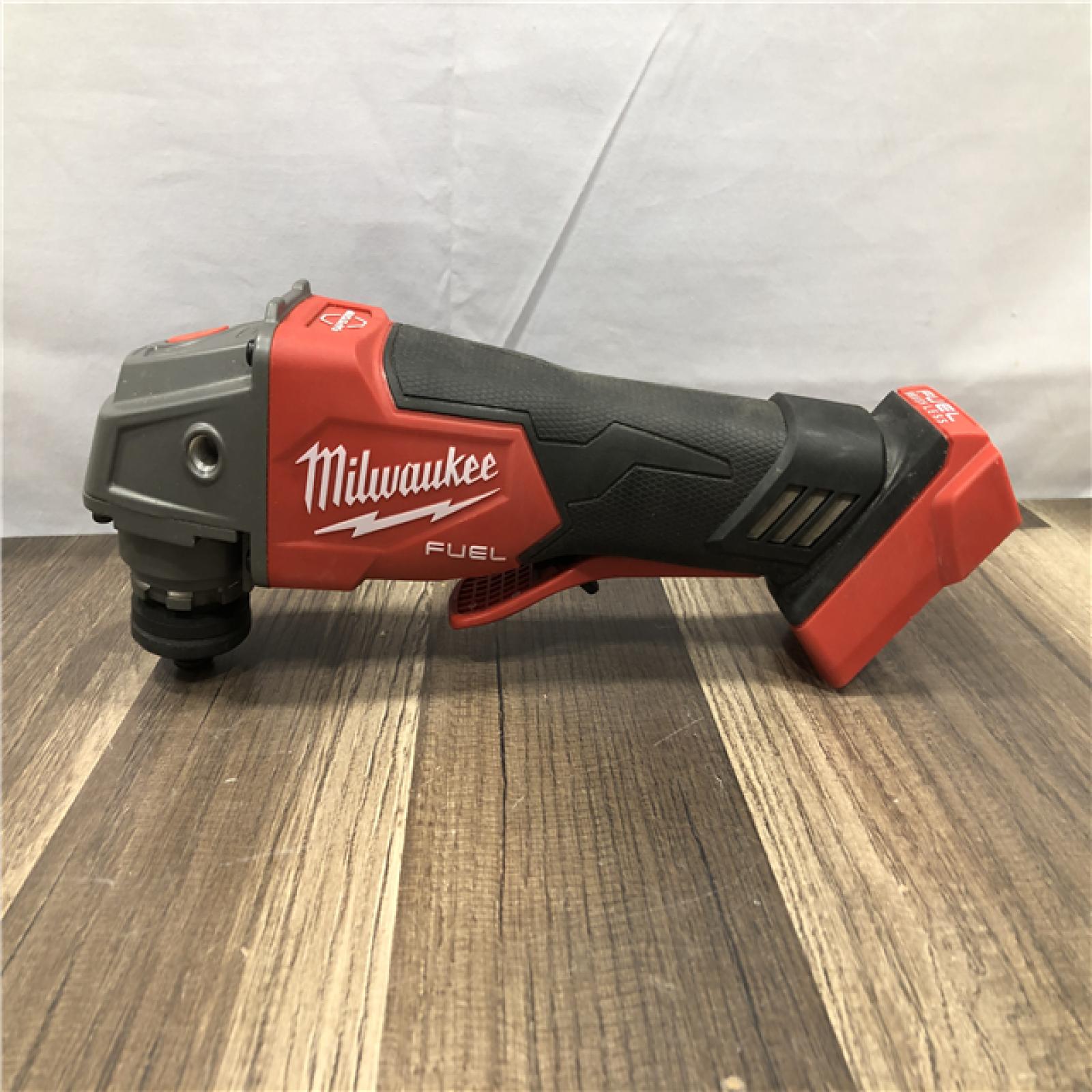 AS-IS Milwaukee FUEL 18V Lithium-Ion Brushless Cordless 4-1/2 in./5 in. Grinder w/Paddle Switch (Tool-Only)