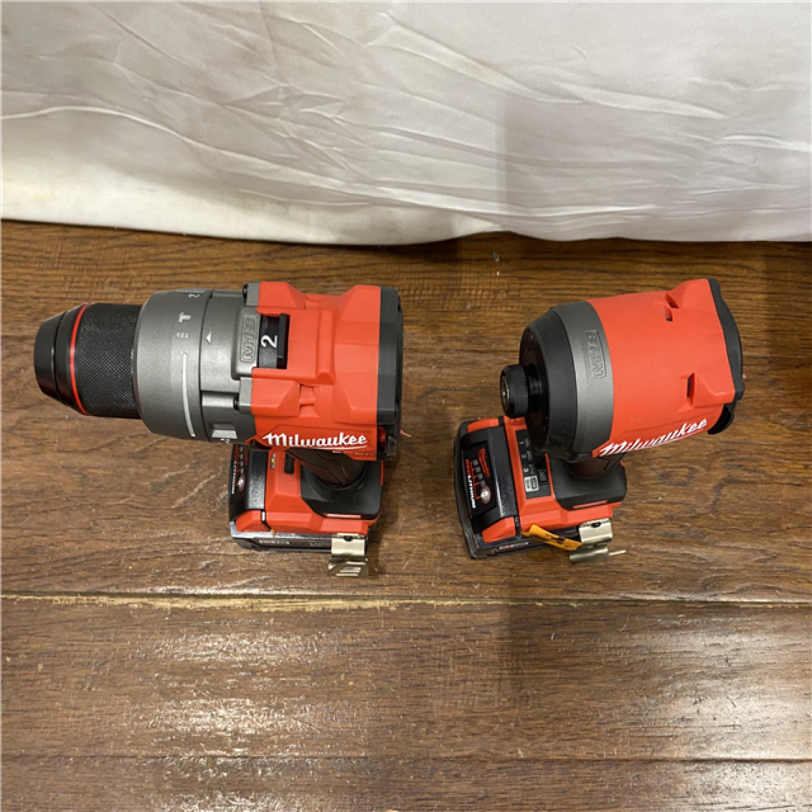 AS-IS MILWAUKEE M18 FUEL 18V Lithium-Ion Brushless Cordless Hammer Drill and Impact Driver Combo Kit (2-Tool) with 2 Batteries