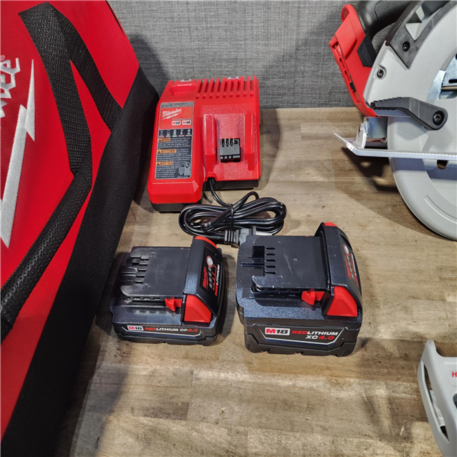 HOUSTON LOCATION - AS-IS (APPEARS LIKE NEW) Milwaukee M18 18-Volt Lithium-Ion Brushless Cordless Combo Kit (4-Tool) with 2-Batteries  1-Charger and Tool Bag