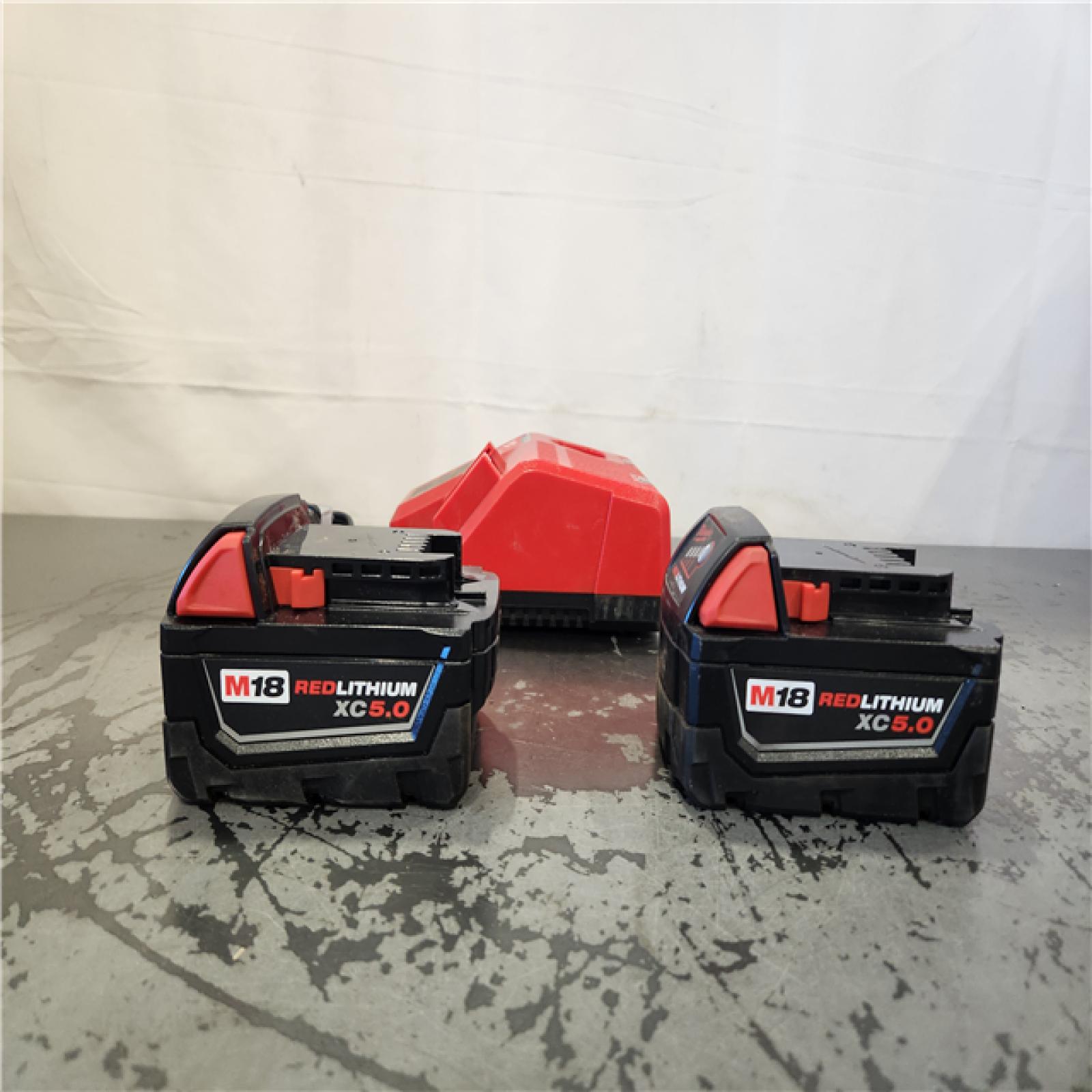 AS-IS- Milwaukee 18-Volt Lithium-Ion XC Starter Kit with Two 5.0Ah Batteries and Charger
