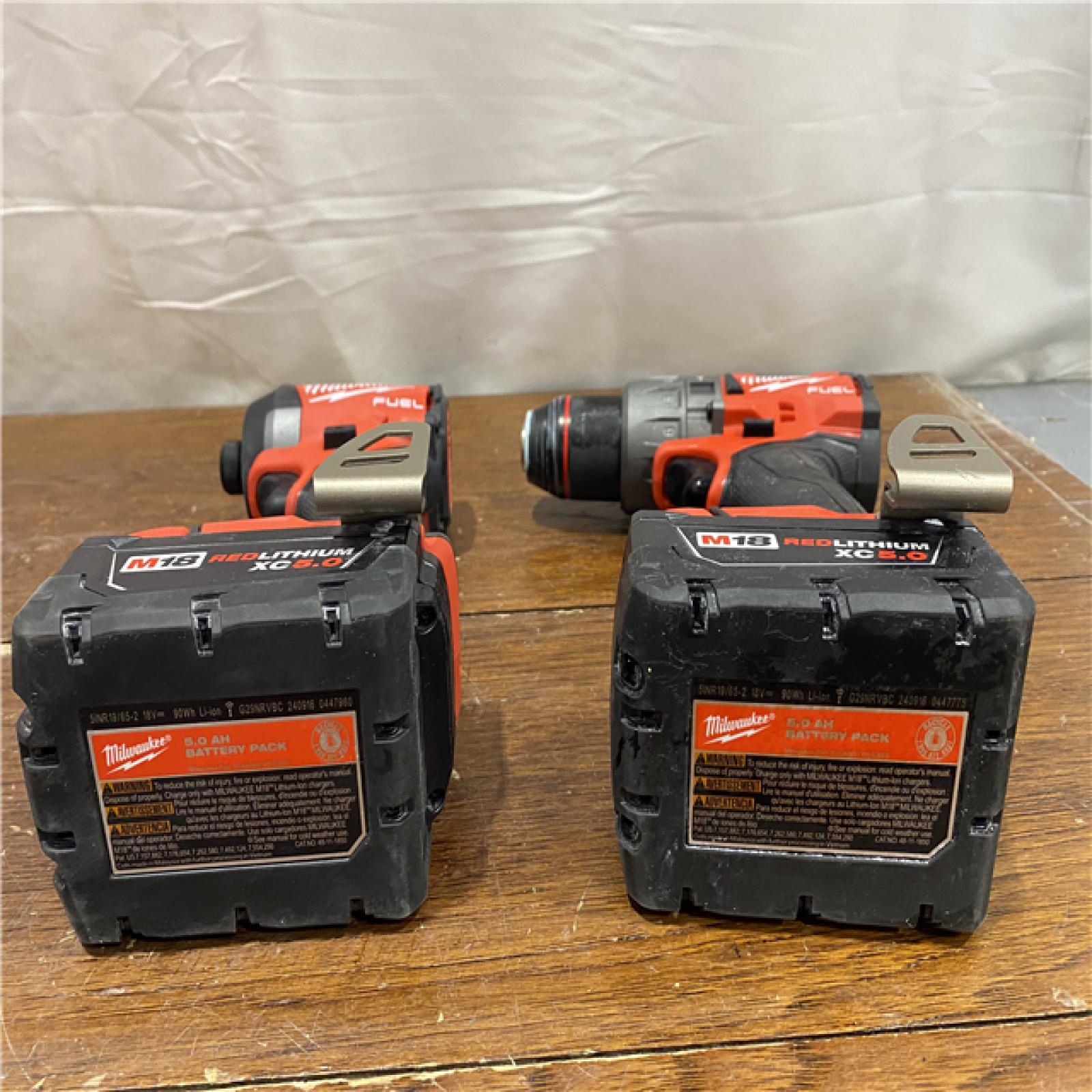 AS-IS MILWAUKEE M18 FUEL 18V Lithium-Ion Brushless Cordless Hammer Drill and Impact Driver Combo Kit (2-Tool) with 2 Batteries