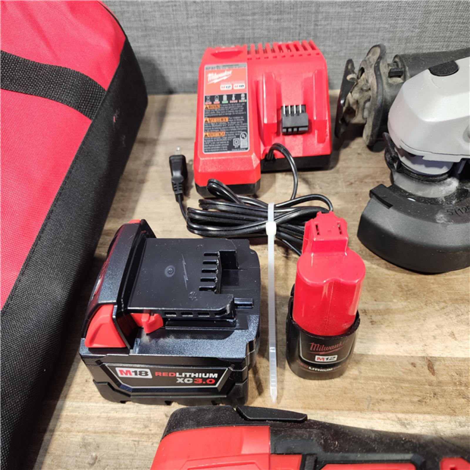 HOUSTON LOCATION - AS-IS MILWAUKEE 7 TOOL COMBO KIT W/ (2) BATTERY & CHARGER