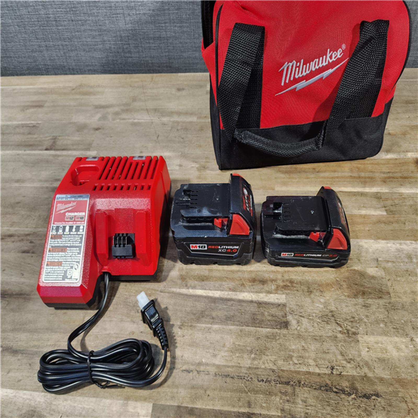 HOUSTON LOCATION - AS-IS M18 18-Volt Lithium-Ion Brushless Cordless Compact Hammer Drill/Impact Combo Kit (2-Tool) with (2) Batteries, Bag