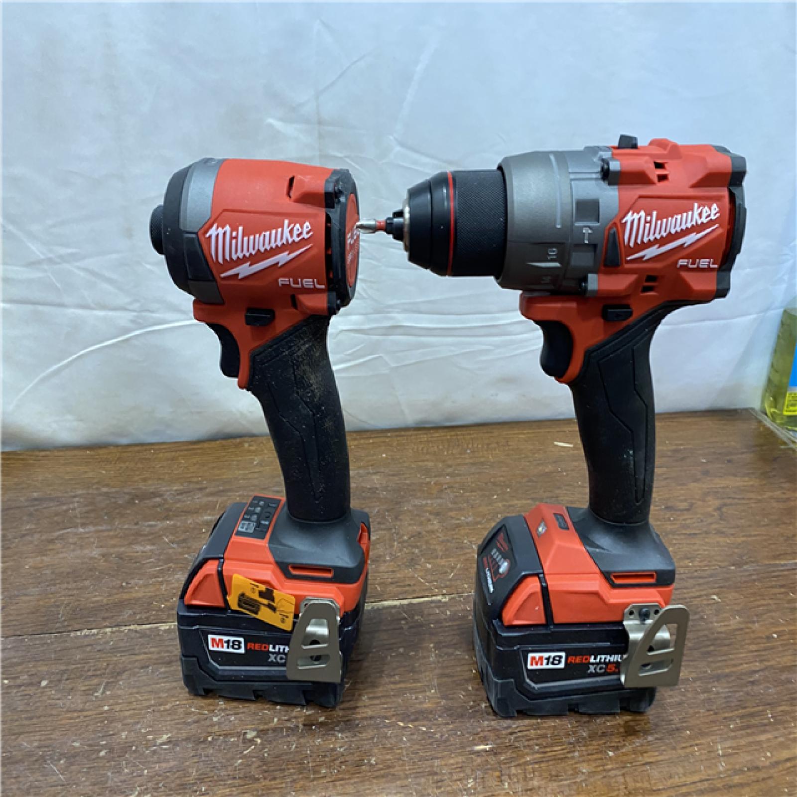 AS-IS MILWAUKEE M18 FUEL 18V Lithium-Ion Brushless Cordless Hammer Drill and Impact Driver Combo Kit (2-Tool) with 2 Batteries