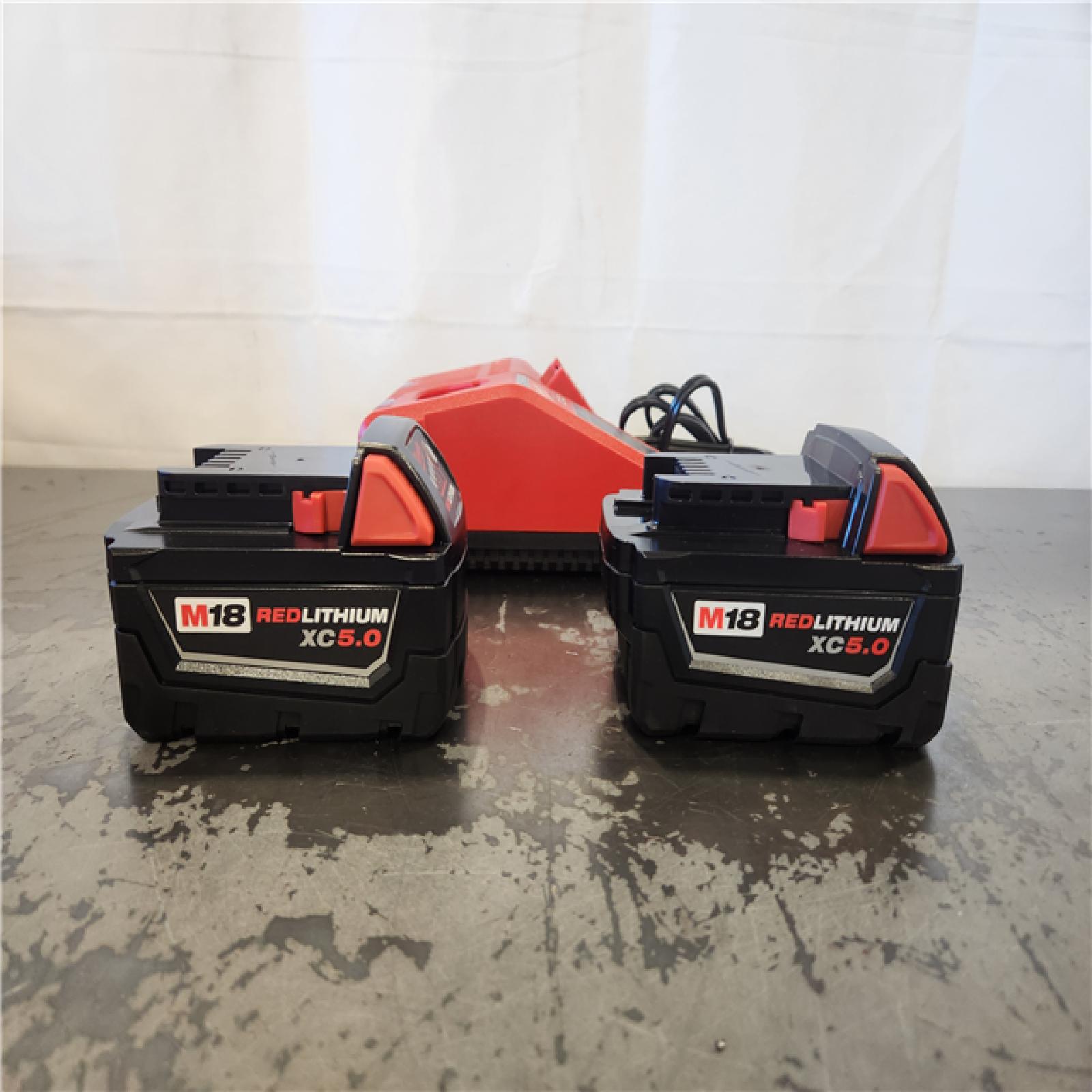 AS-IS-- Milwaukee 18-Volt Lithium-Ion XC Starter Kit with Two 5.0Ah Batteries and Charger