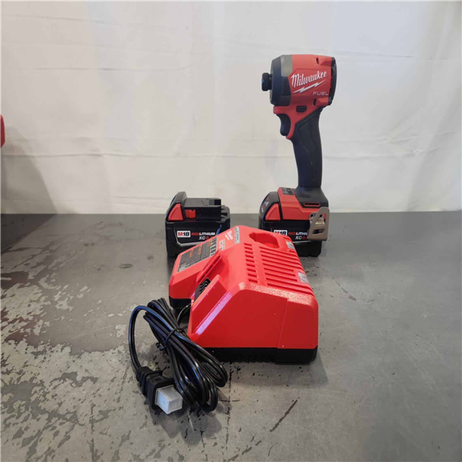 AS-IS- M18 FUEL 18V Lithium-Ion Brushless Cordless 1/4 in. Hex Impact Driver Kit with Two 5.0Ah Batteries Charger