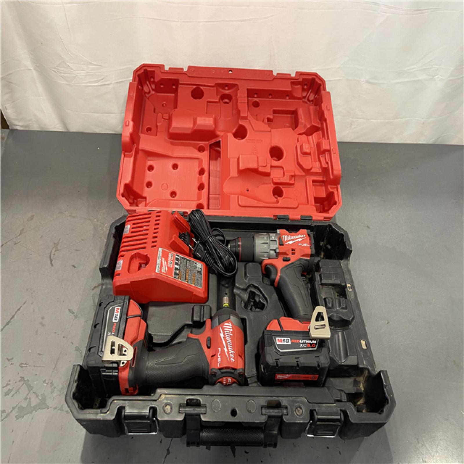 AS-IS- MILWAUKEE FUEL 18V Lithium-Ion Brushless Cordless Hammer Drill and Impact Driver Combo Kit