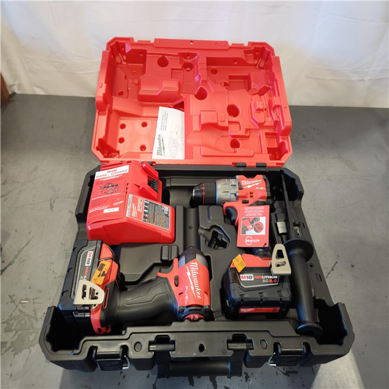 AS-IS- Milwaukee FUEL 18V Lithium-Ion Brushless Cordless Hammer Drill and Impact Driver Combo Kit