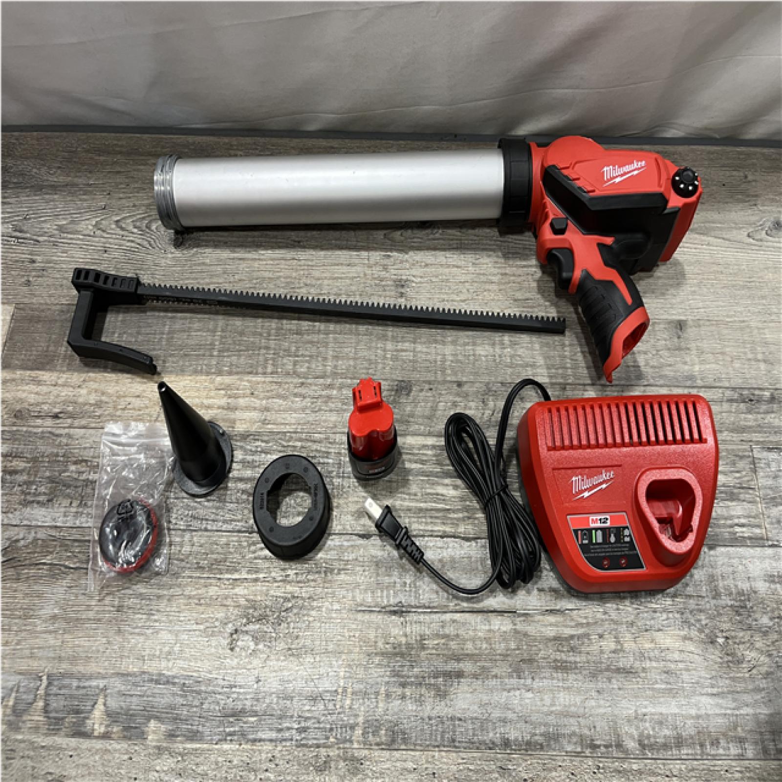 AS-IS Milwaukee 12V Lithium-ion Cordless 20 oz. Aluminum Barrel Adhesive and Caulk Gun Kit