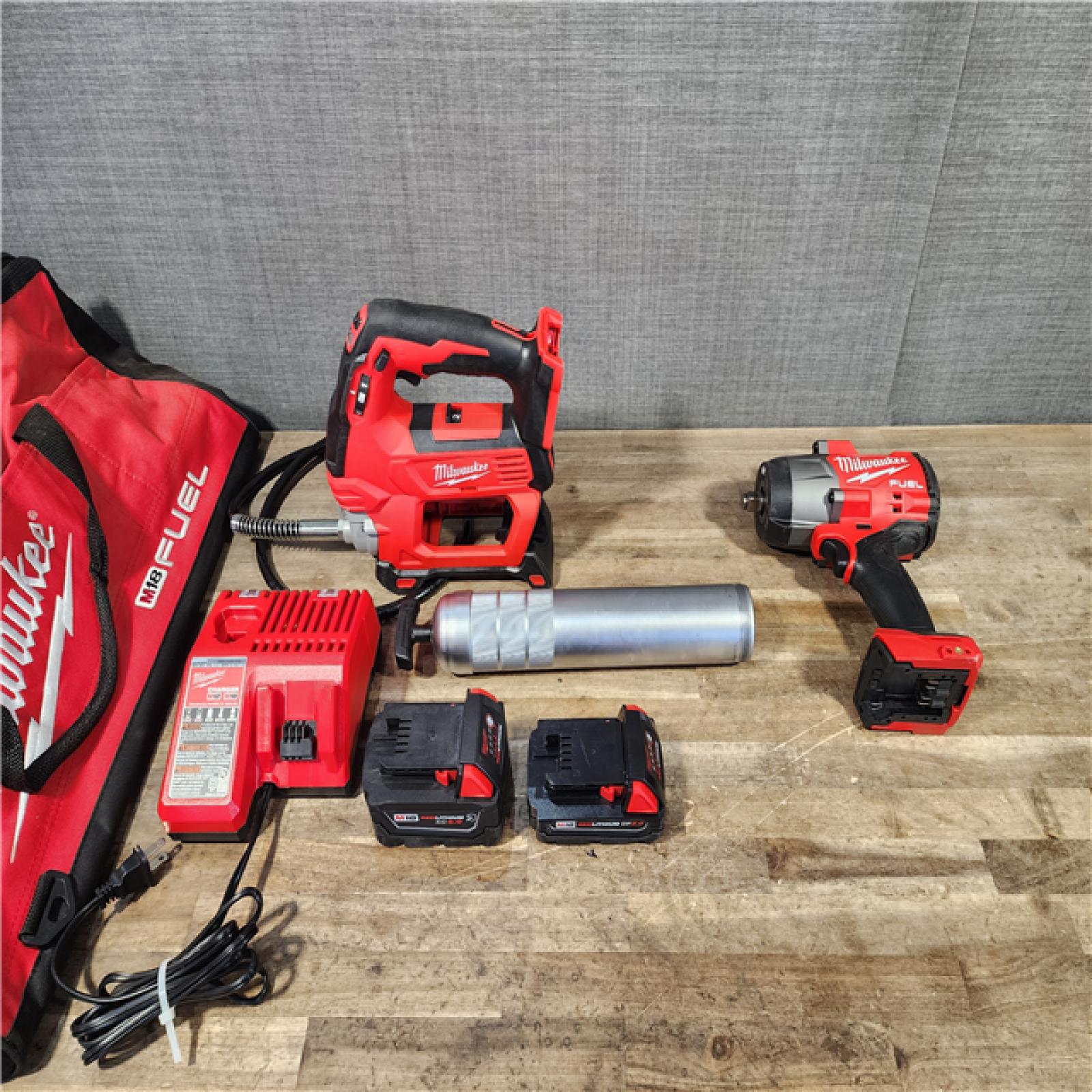 HOUSTON LOCATION - AS-IS MILWAUKEE 2 TOOL COMBO KIT W/ (2) BATTERY & CHARGER