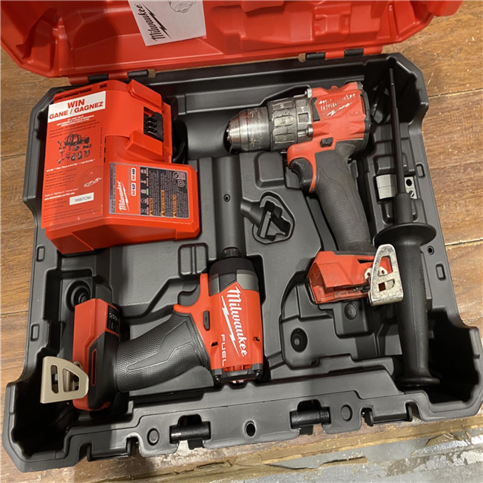 AS-IS MILWAUKEE M18 FUEL 18V Lithium-Ion Brushless Cordless Hammer Drill and Impact Driver Combo Kit (2-Tool) with 2 Batteries