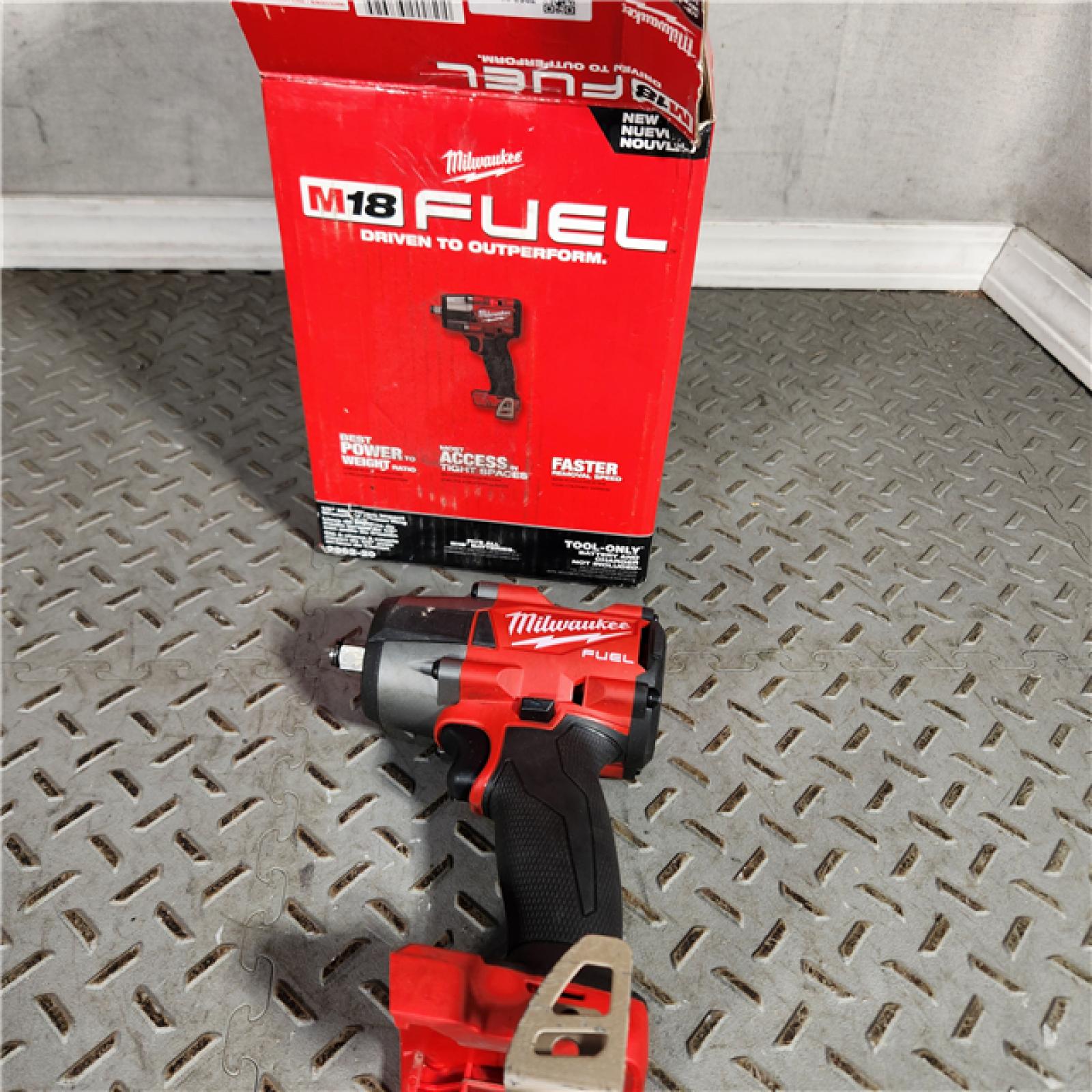 Houston location- AS-IS Milwaukee M18 FUEL 1/2 Mid-Torque Impact Wrench TOOL ONLY