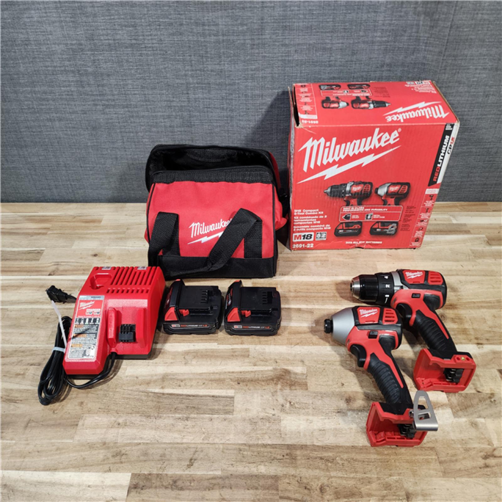 HOUSTON LOCATION - AS-IS Milwaukee M18 18V Lithium-Ion Cordless Drill Driver/Impact Driver Combo Kit