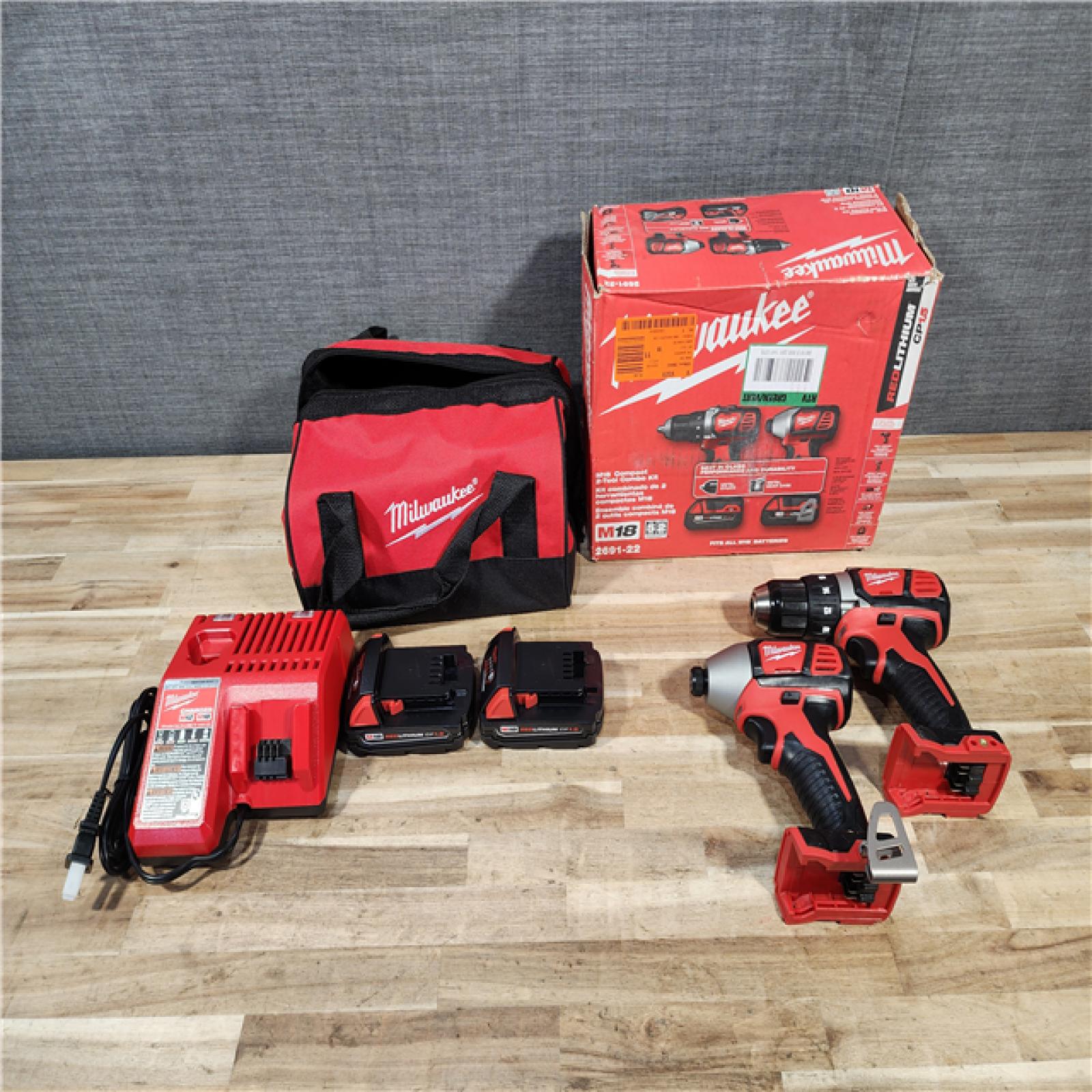 HOUSTON LOCATION - AS-IS Milwaukee 18V Lithium-Ion Cordless Drill Driver/Impact Driver Combo Kit