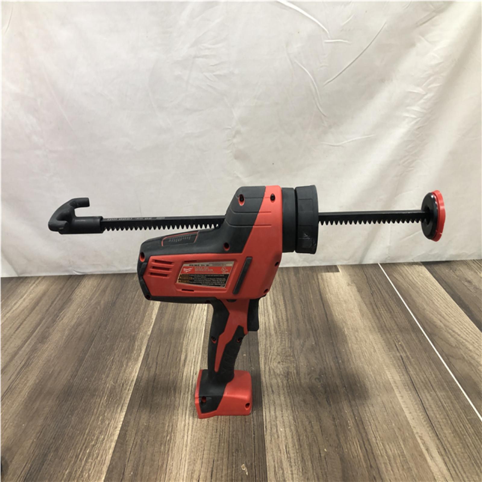 AS-IS M18 18V Lithium-Ion Cordless 20 Oz. Caulk and Adhesive Gun Kit Aluminum Sausage W/(1) 1.5Ah Battery  Charger