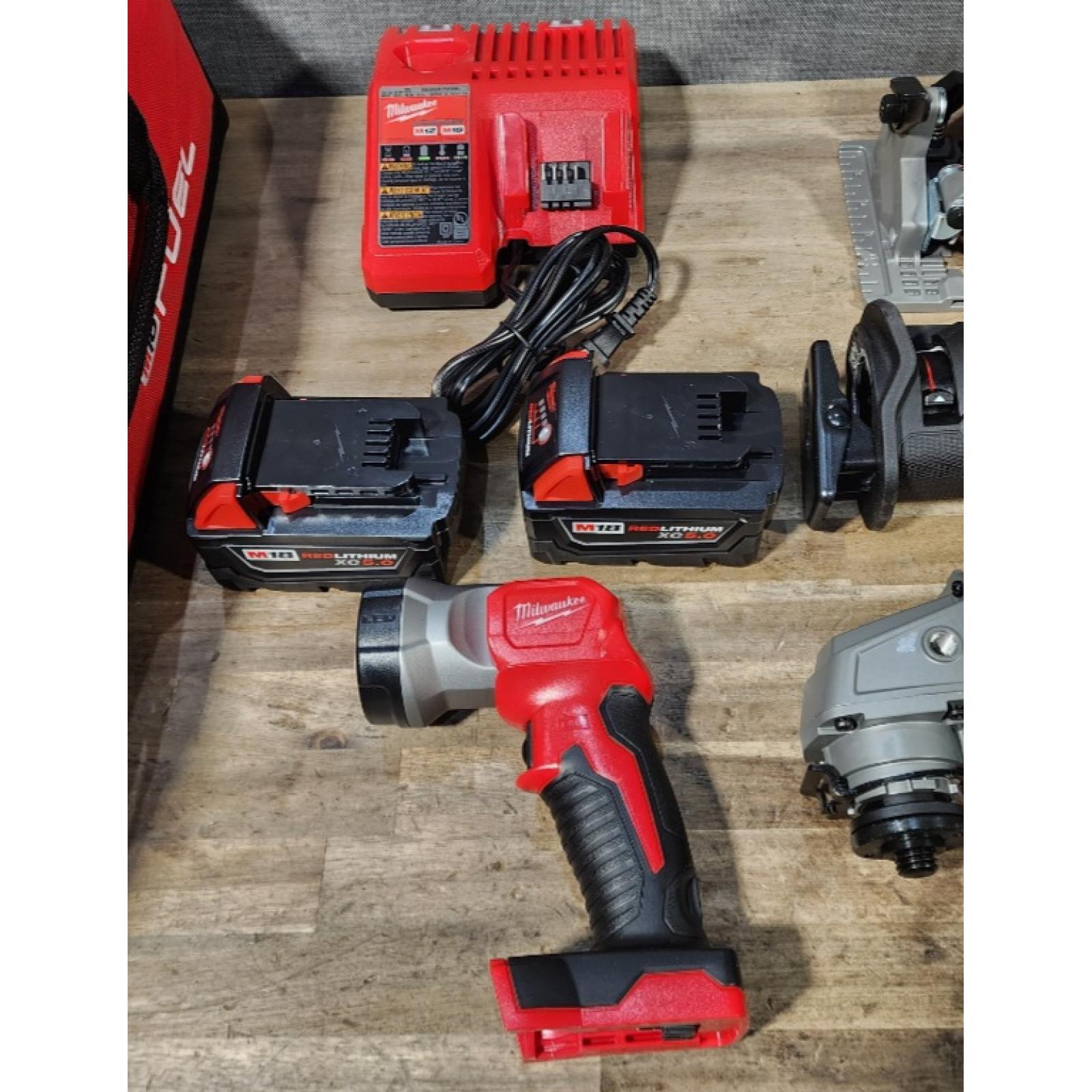 HOUSTON LOCATION - AS-IS (APPEARS LIKE NEW) Milwaukee M18 FUEL 18V Lithium-Ion Brushless Cordless Combo Kit with Two 5.0 Ah Batteries  1 Charger  2 Tool Bags (7-Tool)