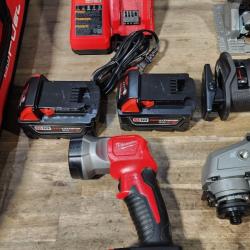 HOUSTON LOCATION - AS-IS (APPEARS LIKE NEW) Milwaukee M18 FUEL 18V Lithium-Ion Brushless Cordless Combo Kit with Two 5.0 Ah Batteries  1 Charger  2 Tool Bags (7-Tool)