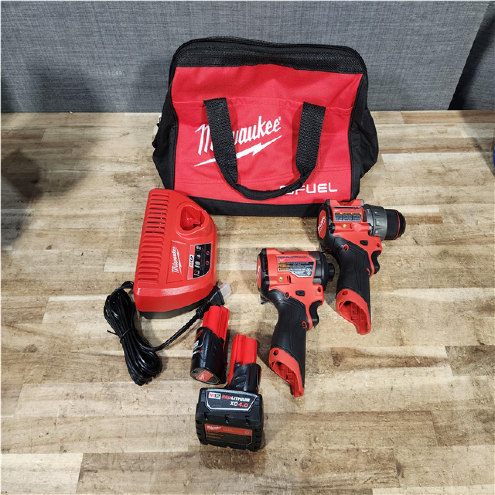 Houston Location AS-IS Milwaukee FUEL Drill and FUEL Impact and Batteries QTY/2 and Charger