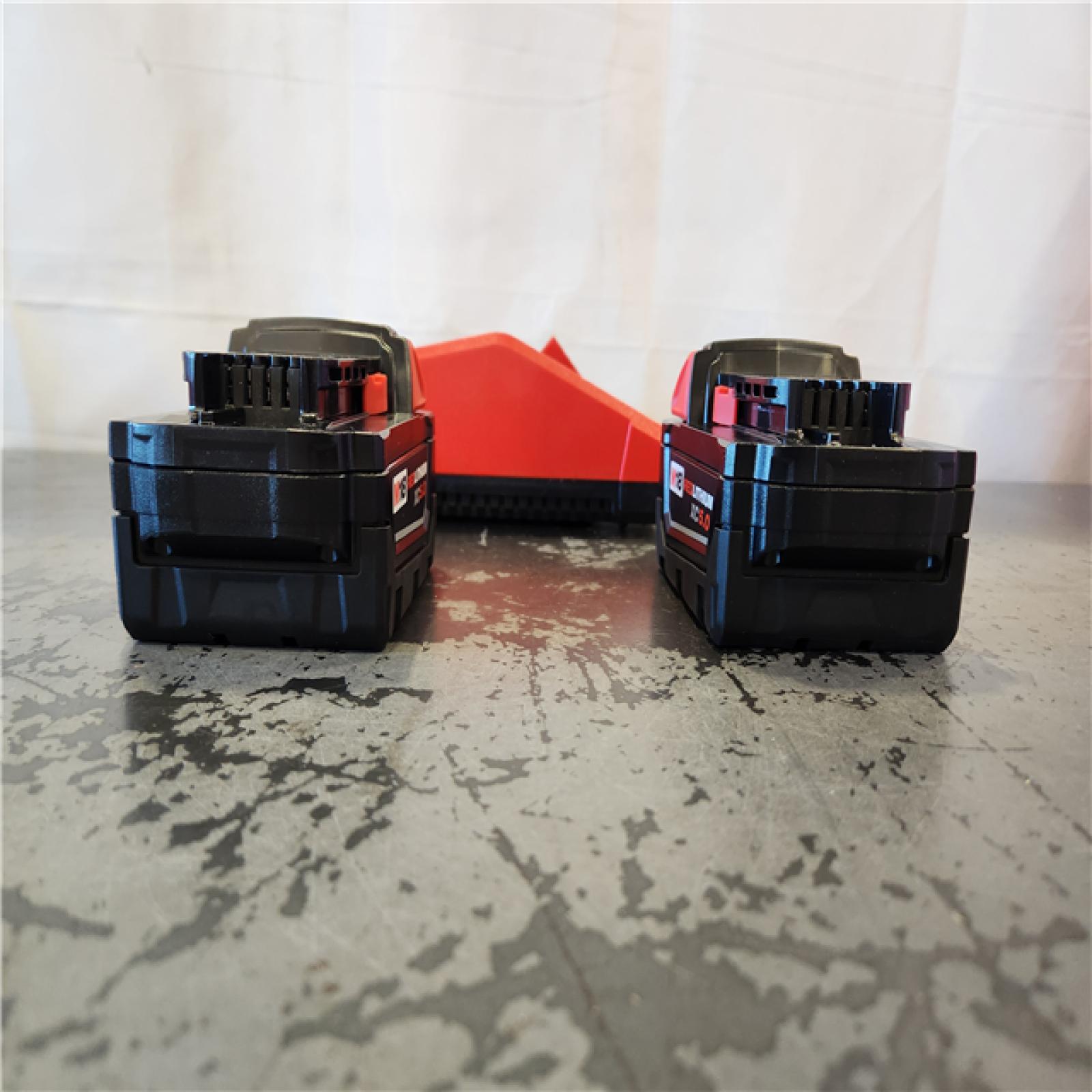 AS-IS- Milwaukee 18-Volt Lithium-Ion XC Starter Kit with Two 5.0Ah Batteries and Charger