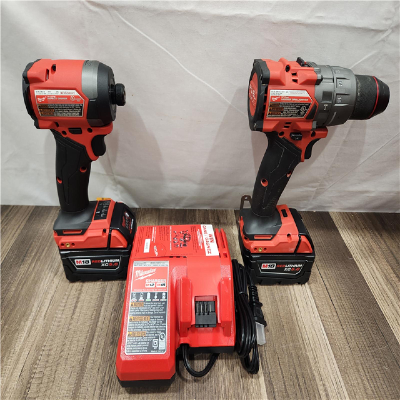AS-IS- MILWAUKEE FUEL 18V Lithium-Ion Brushless Cordless Hammer Drill and Impact Driver Combo Kit