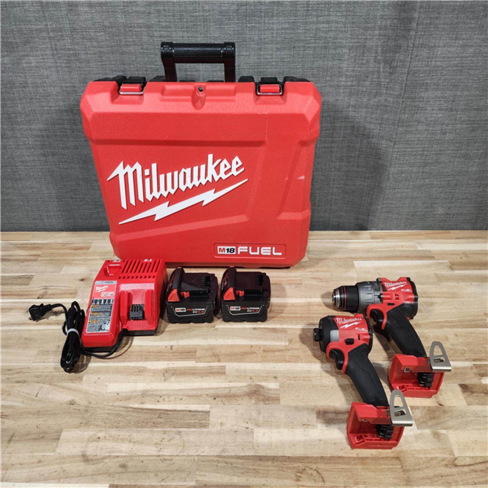 HOUSTON LOCATION - AS-IS Milwaukee FUEL 12-Volt Lithium-Ion Brushless Cordless Hammer Drill and Impact Driver Combo Kit