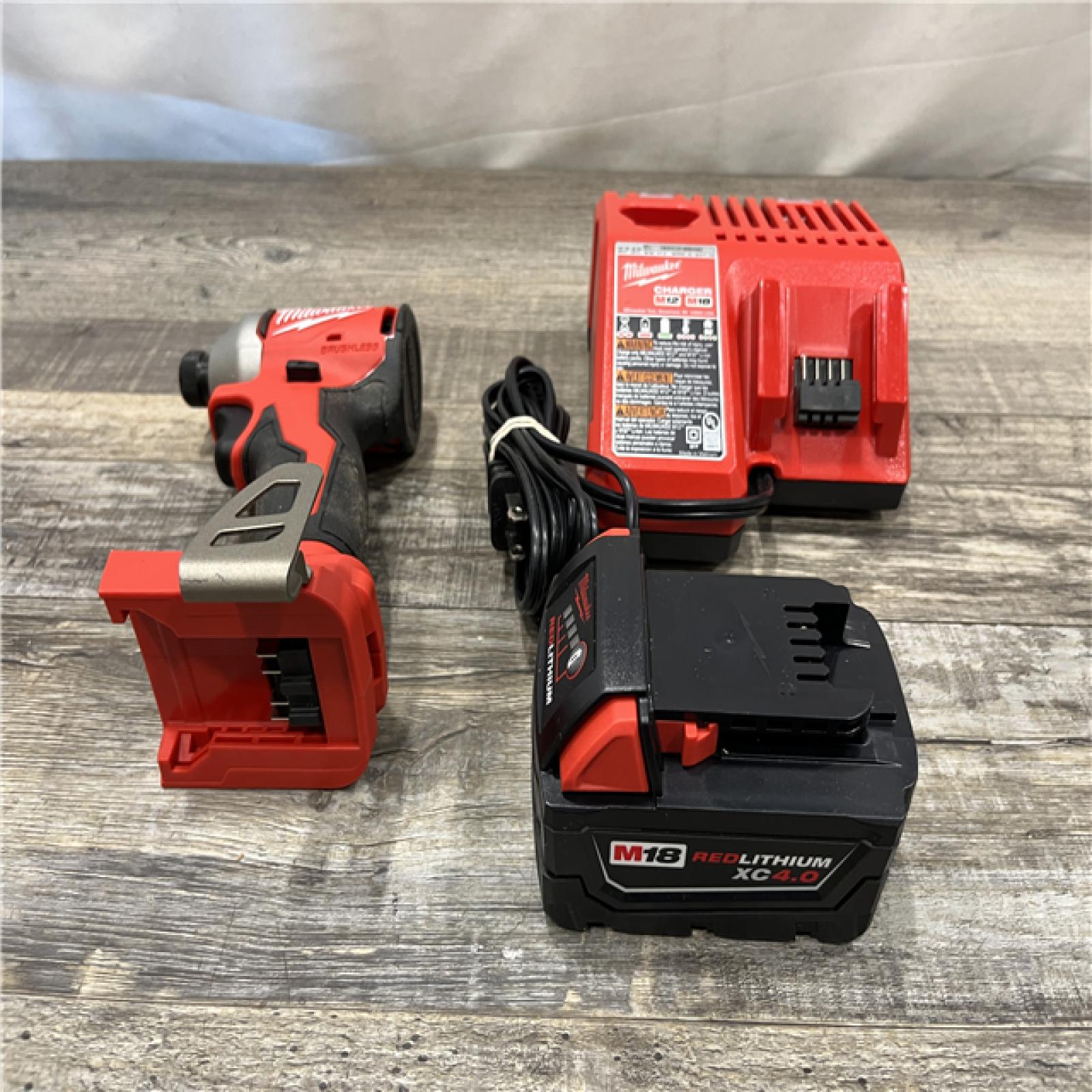 AS-IS Milwaukee 18V Lithium-Ion Compact Brushless Cordless 1/4 in. Impact Driver Kit