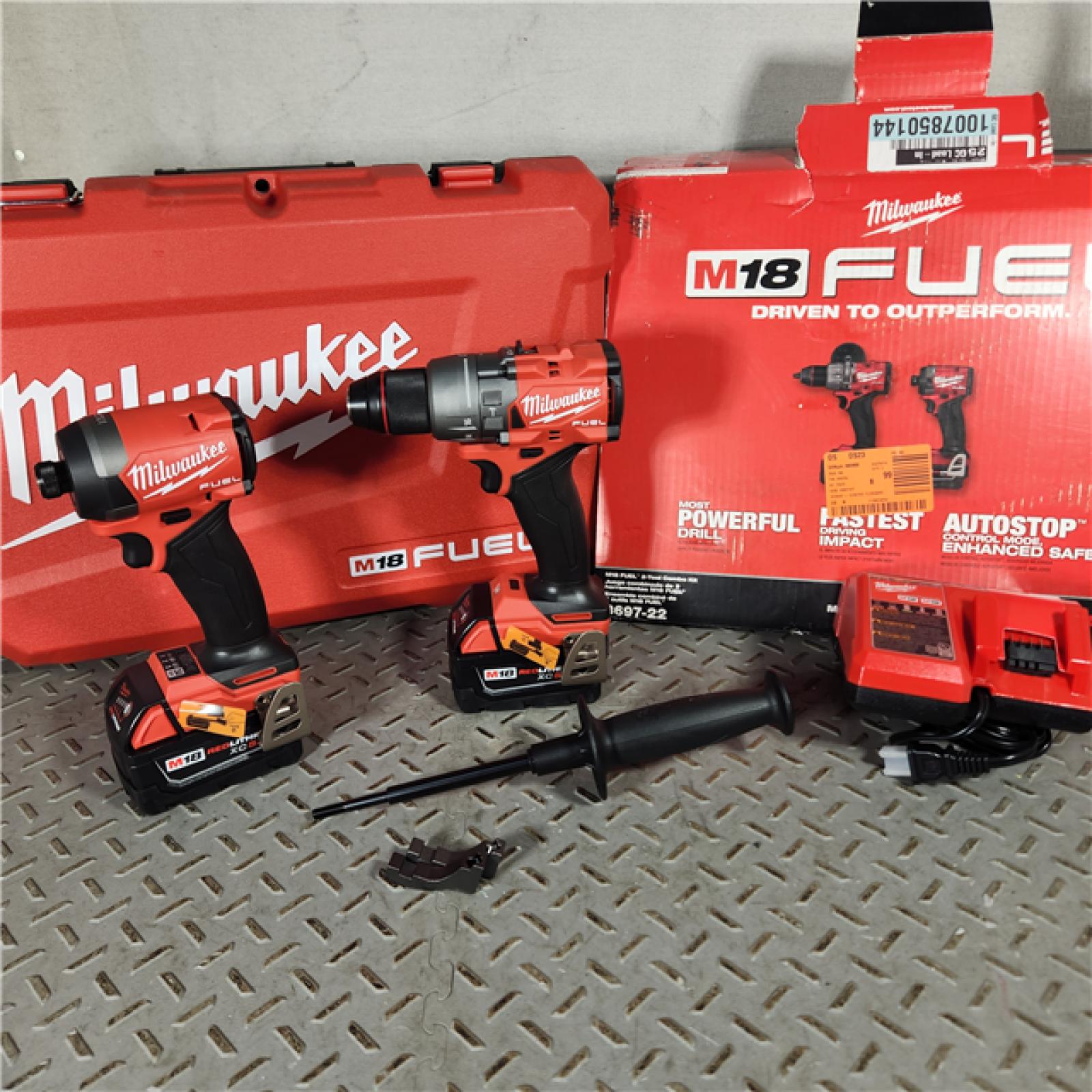 Houston location AS-IS Milwaukee 3697-22 M18 FUEL 1/2 Hammer Driller/Driver &1/4 Hex Impact Driver 2 Tool Combo Kit Appears in new condition