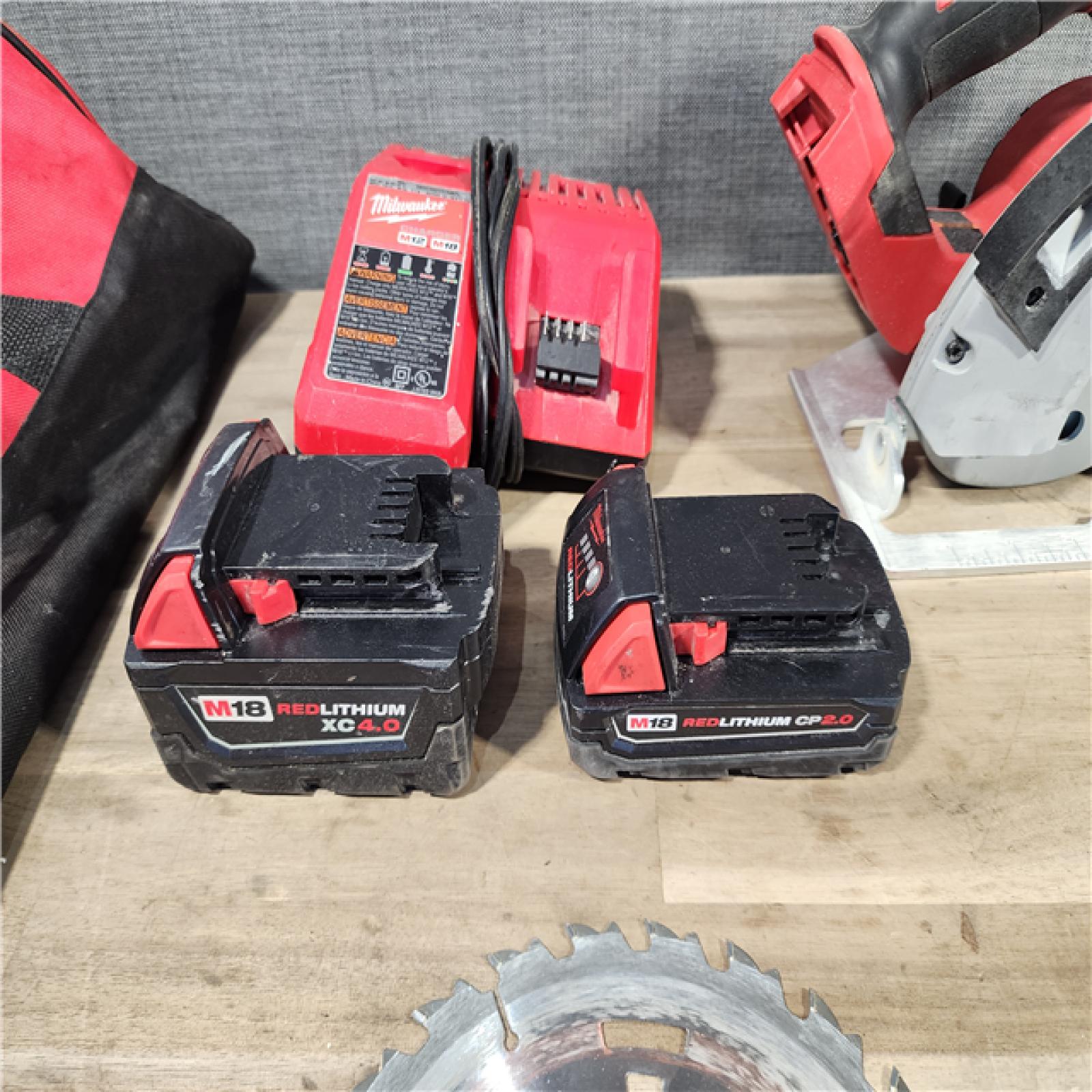 HOUSTON LOCATION - AS-IS Milwaukee M18 18-Volt Lithium-Ion Brushless Cordless Combo Kit (4-Tool) with 2-Batteries, 1-Charger and Tool Bag