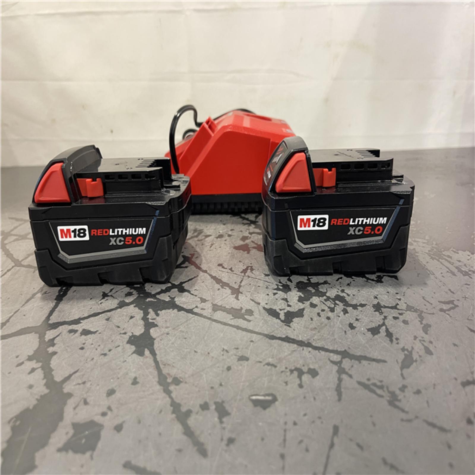 AS-IS- Milwaukee M18 18-Volt Lithium-Ion XC Starter Kit with Two 5.0Ah Batteries and Charger