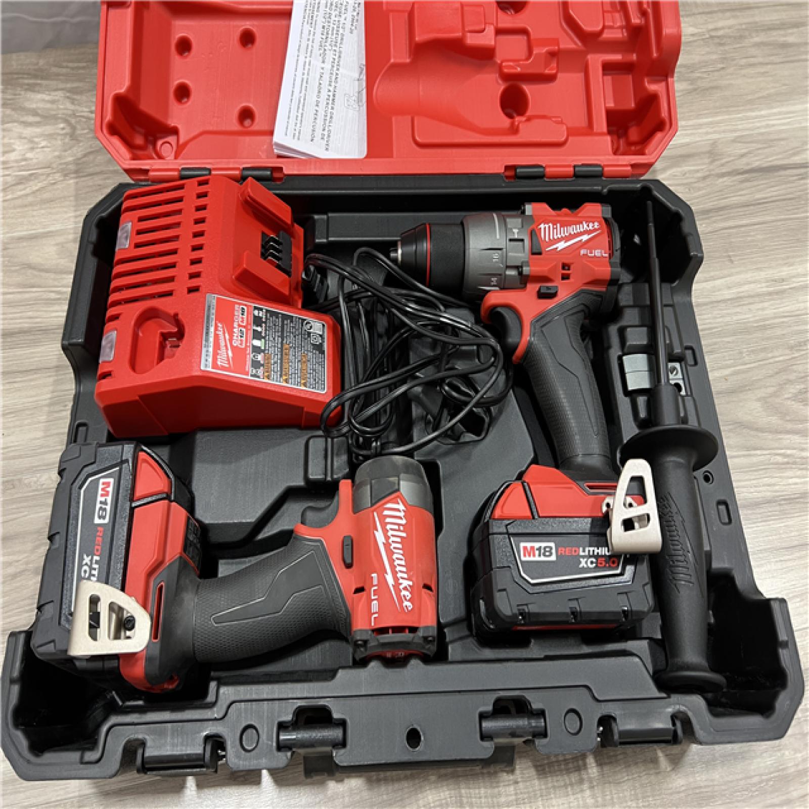 AS-IS Milwaukee FUEL 18V Lithium-Ion Brushless Cordless Hammer Drill and Impact Driver Combo Kit
